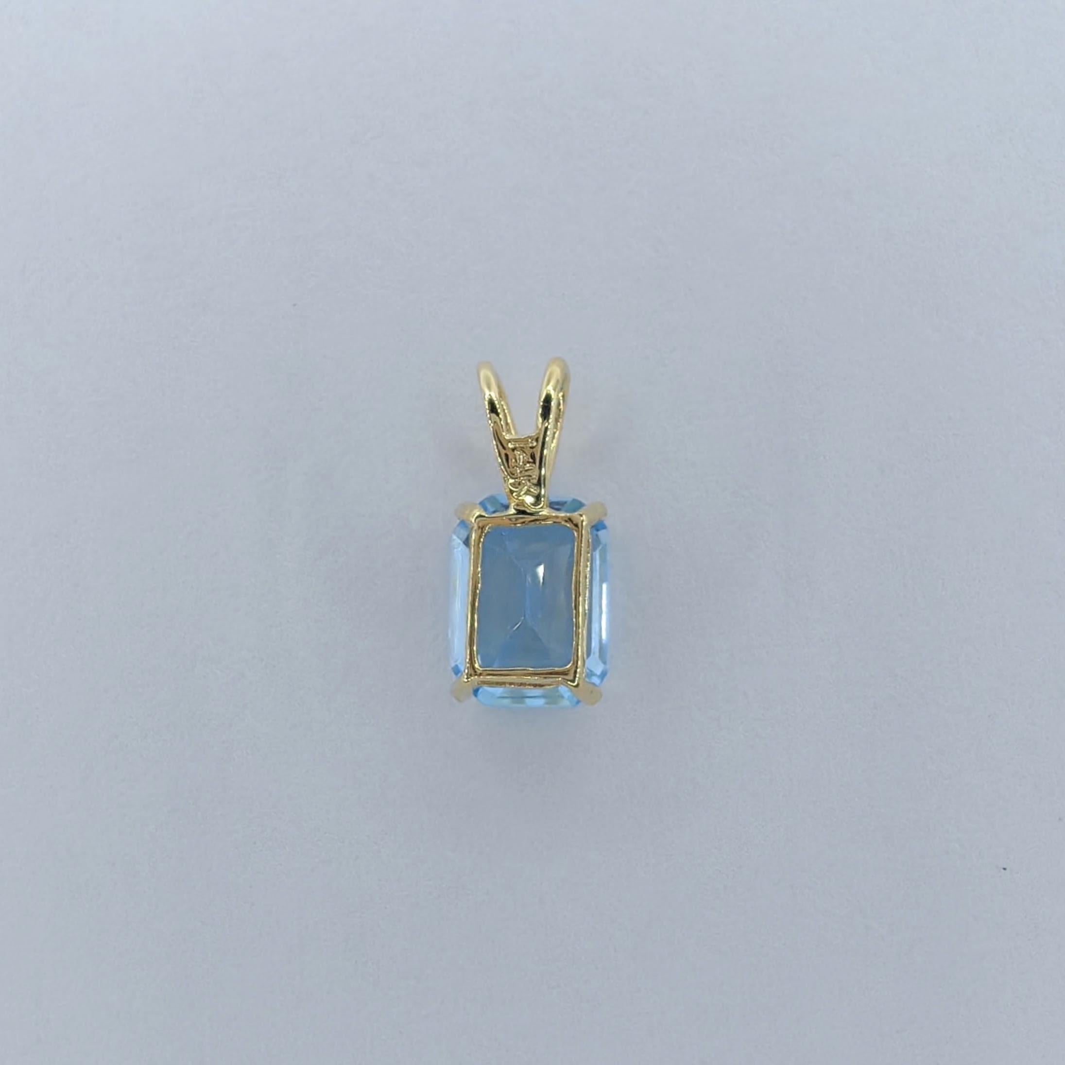 Women's Vintage 1980's Emerald Cut Blue Topaz Necklace Pendant in 14K Yellow Gold #1 For Sale