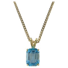 Vintage 1980's Emerald Cut Blue Topaz Necklace Pendant in 14K Yellow Gold #1