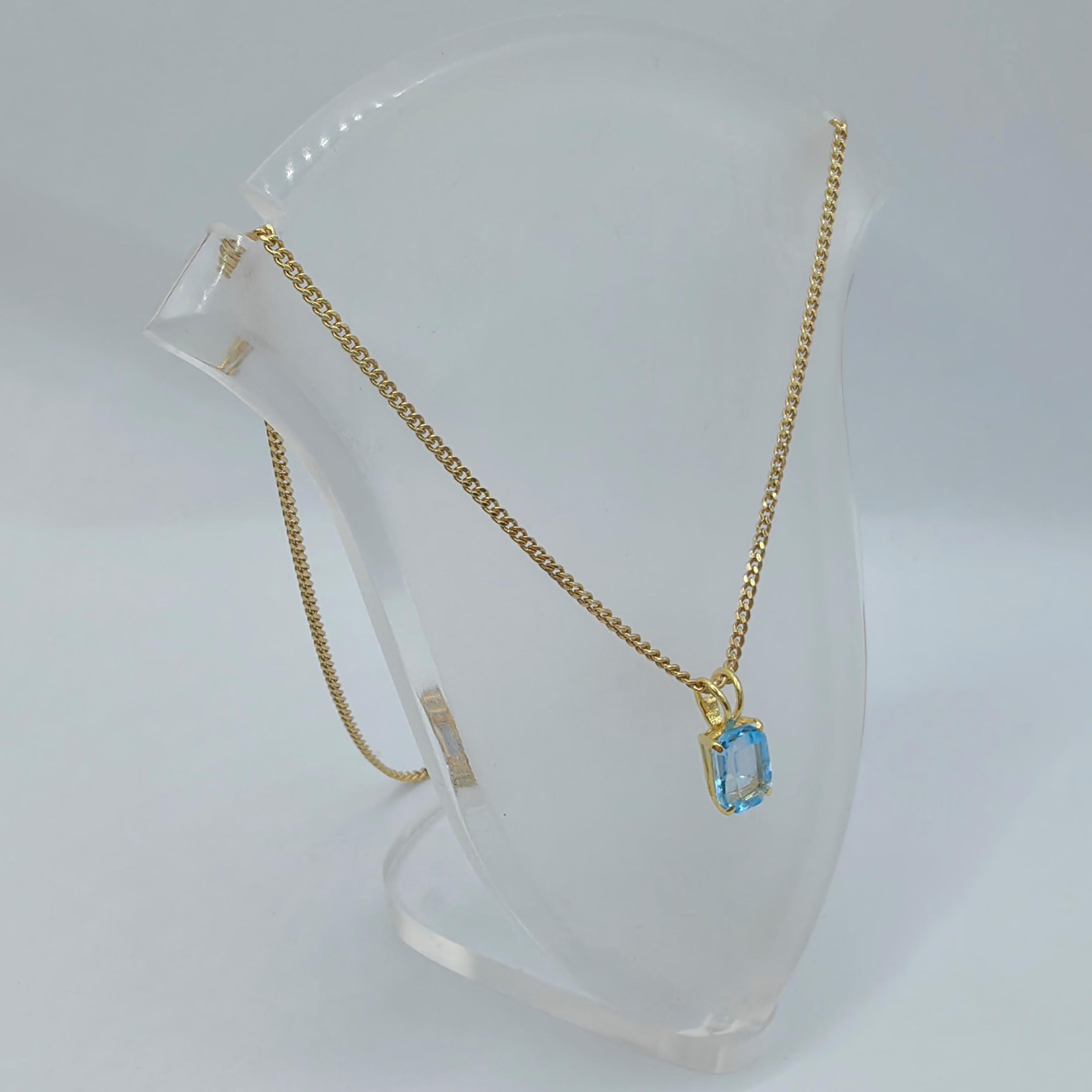 Contemporary Vintage 1980's Emerald Cut Blue Topaz Necklace Pendant in 14K Yellow Gold #2 For Sale