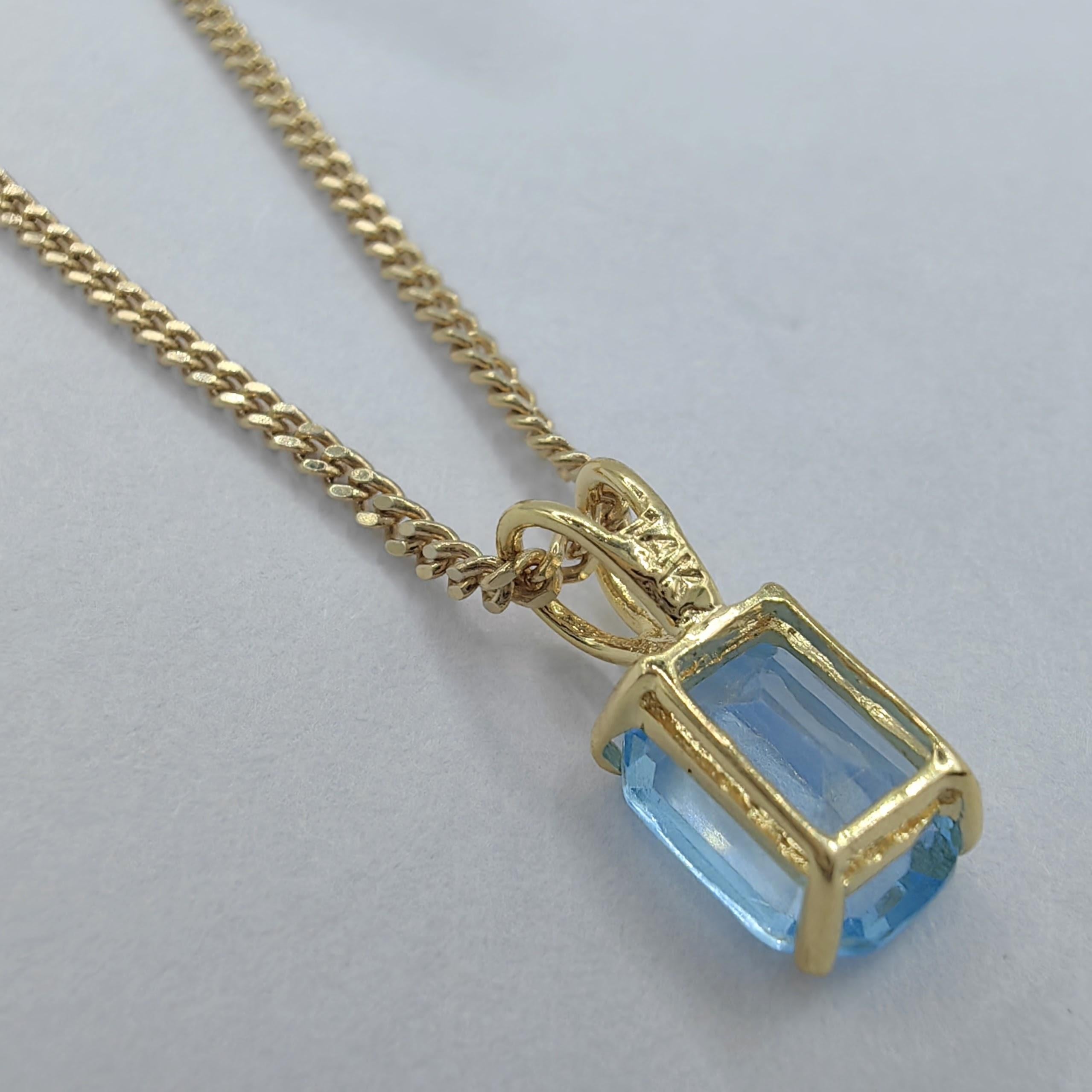 Women's Vintage 1980's Emerald Cut Blue Topaz Necklace Pendant in 14K Yellow Gold #2 For Sale