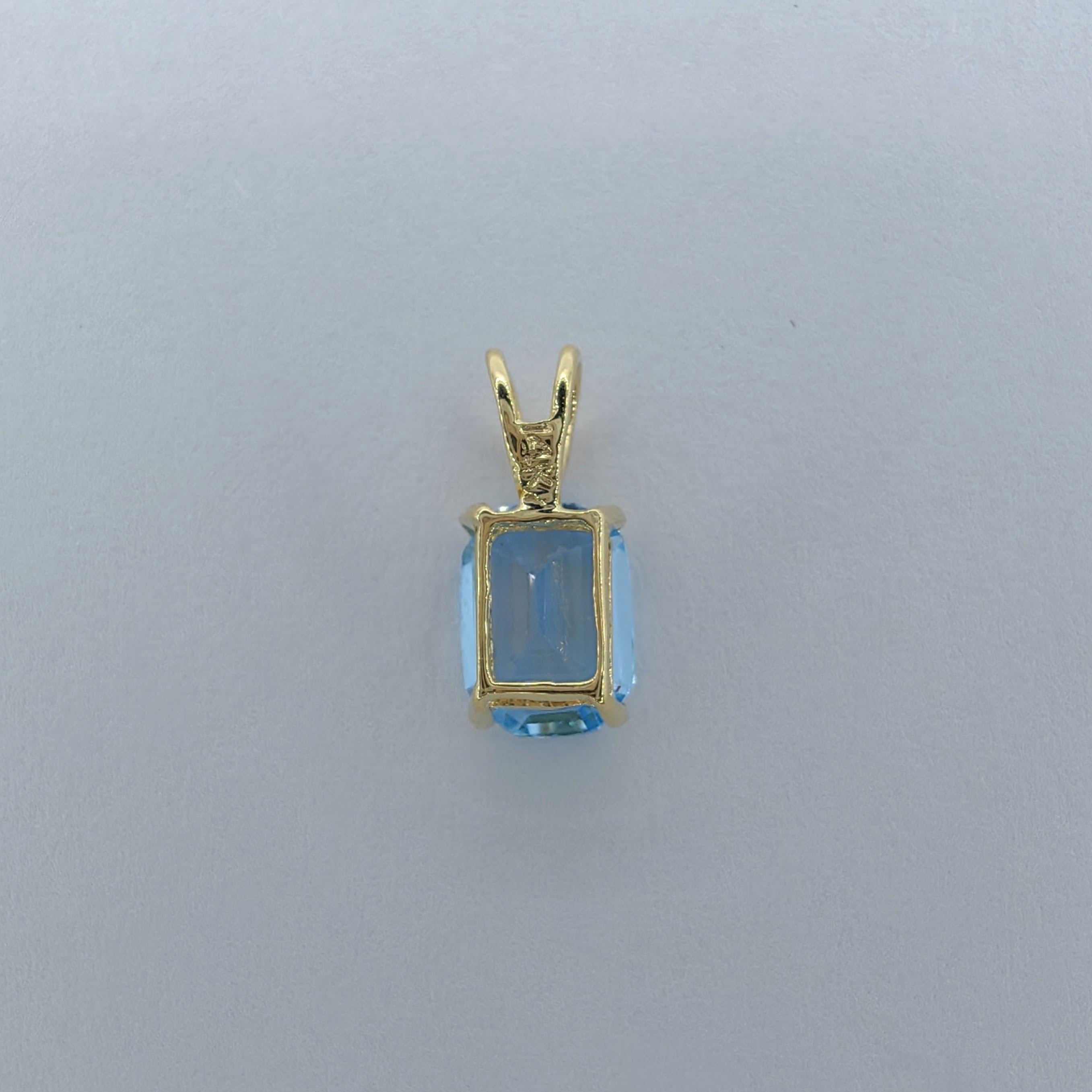 Vintage 1980's Emerald Cut Blue Topaz Necklace Pendant in 14K Yellow Gold #2 For Sale 2
