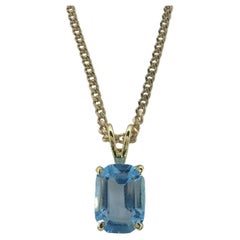 Vintage 1980's Emerald Cut Blue Topaz Necklace Pendant in 14K Yellow Gold