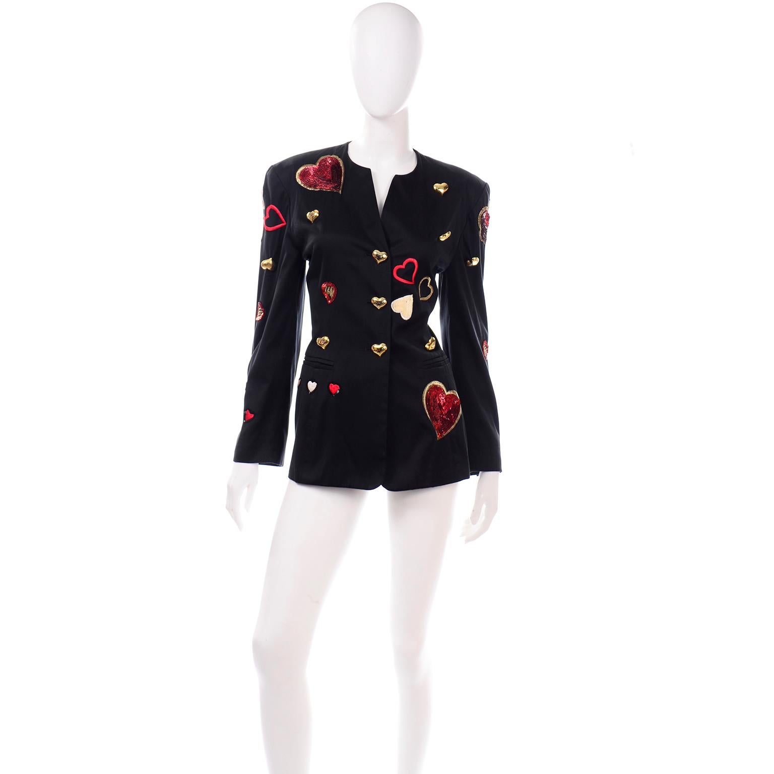 This amazing vintage 1980's Escada jacket is one of our favorites! Designed by Margaretha Ley in the 1980's, the blazer has fun gold metal heart buttons and is embroidered with gold hearts embellished with red, cream and white sequins.  Hearts were