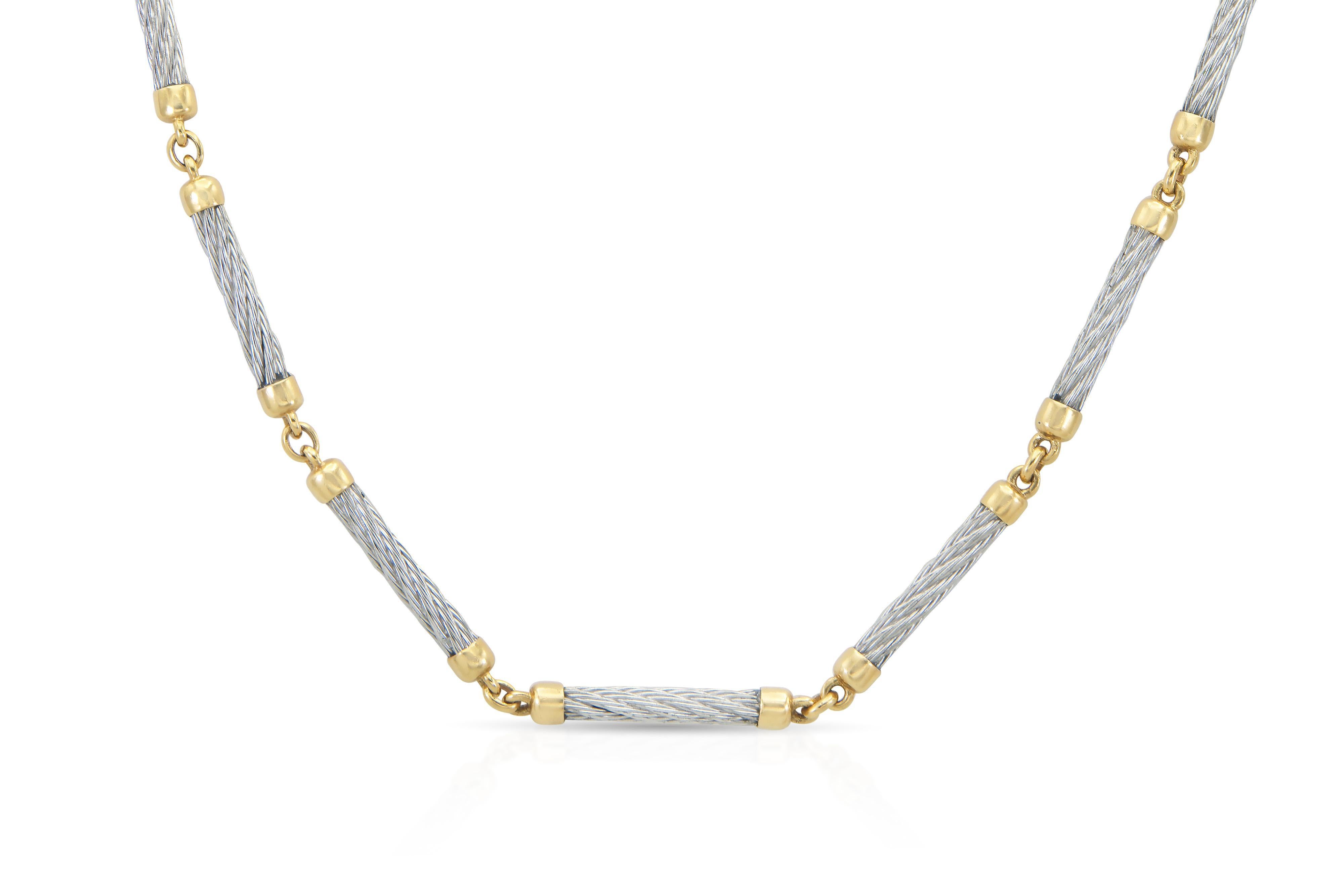 Finely crafted in 18k yellow gold and stainless steel.
Signed by Fred Paris
Circa 1980
Chain 30 1/2 inches