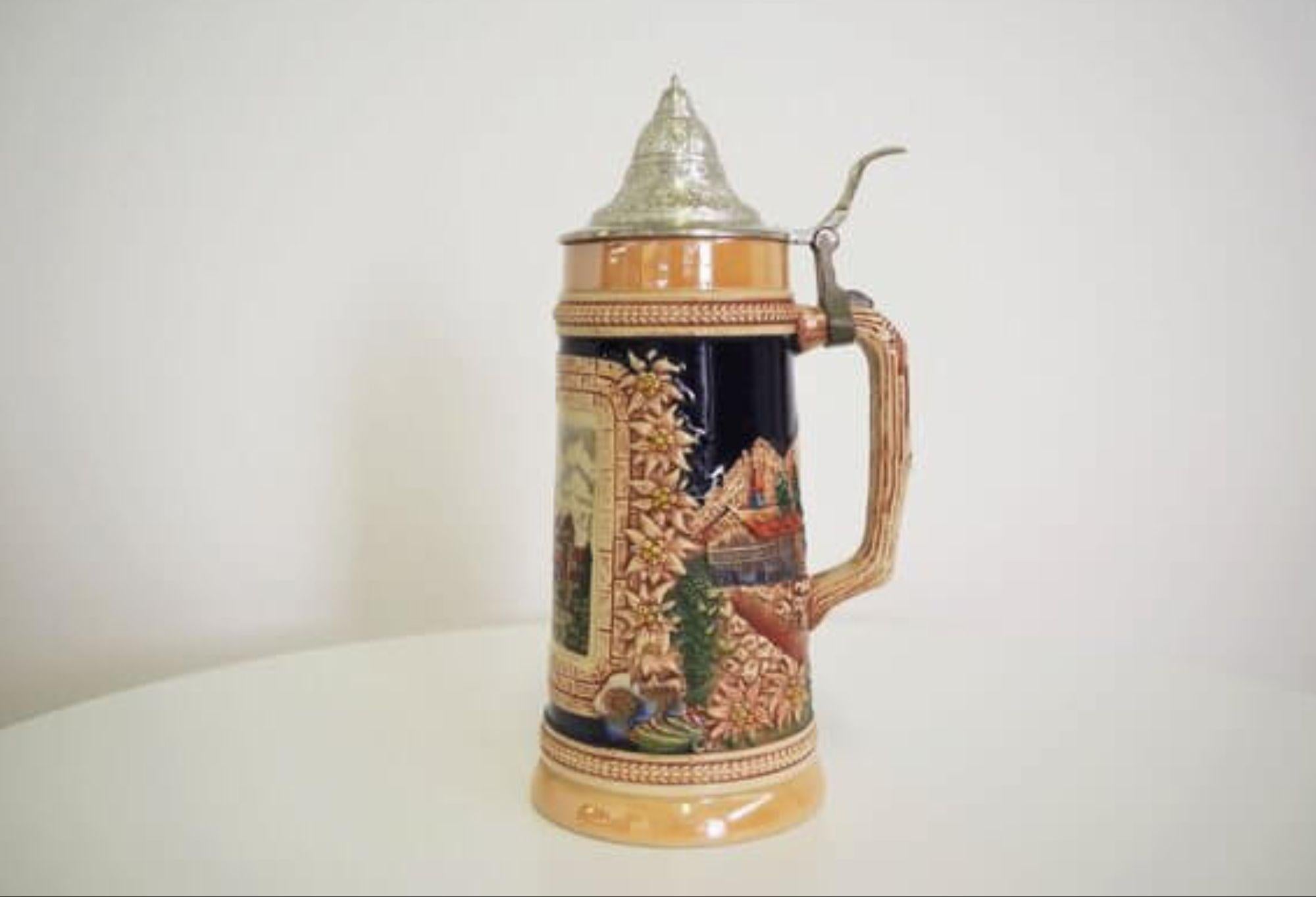 Vintage 1980s German Ceramic Beer Stein – Traditional Bavarian Design

Step into the heart of German tradition with this vintage ceramic beer stein from the 1980s, featuring a beautifully detailed Bavarian motif. Perfect for beer enthusiasts or