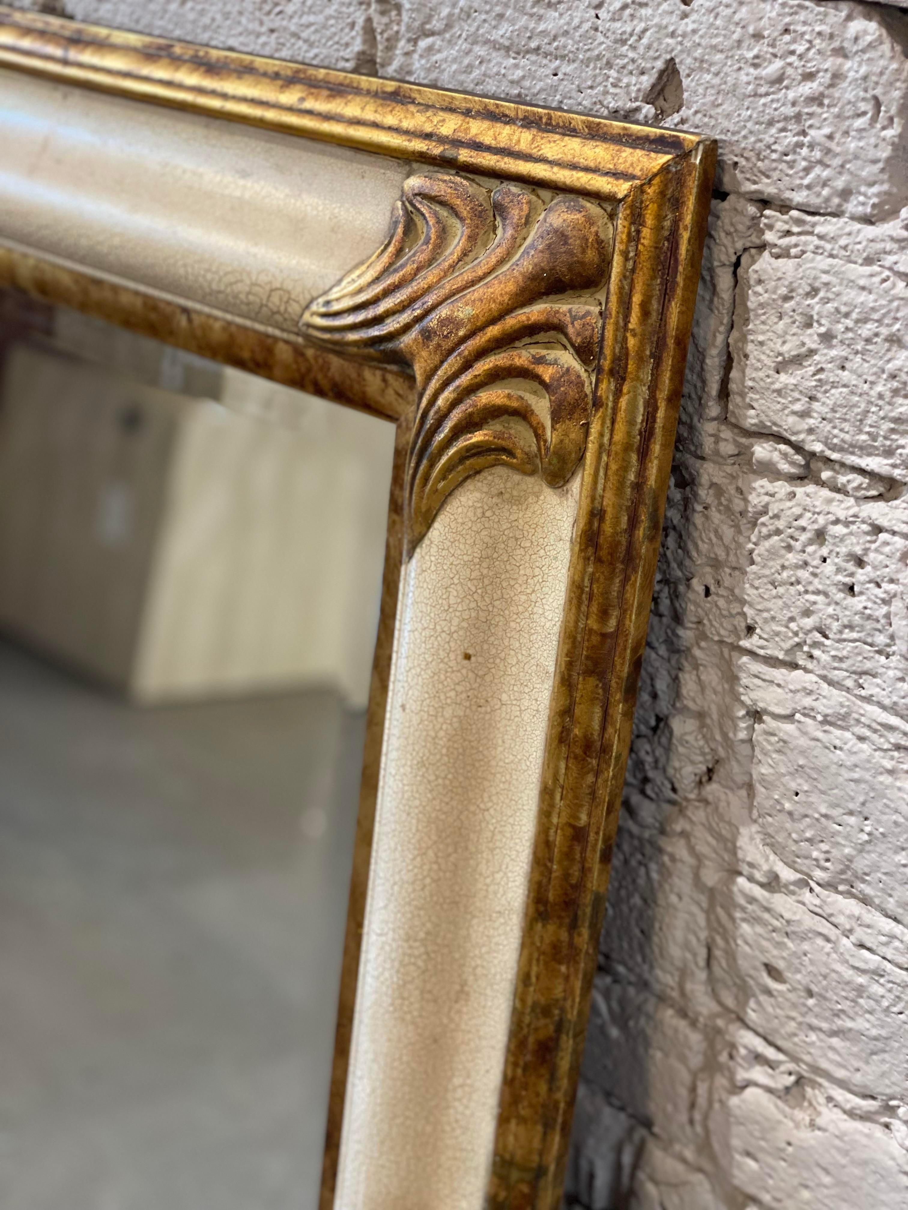 Beautiful vintage mirror with gold details and a creamy milk crackled paint finish. Can be oriented vertically or horizontally.