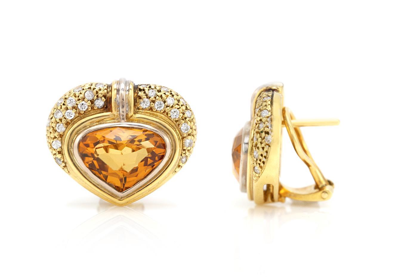 Finely crafted in 18k yellow gold featuring Heart Shaped Citrines and Round Brilliant cut Diamonds weighing a total of approximately 0.60 carat.
Circa 1980s
Made in France