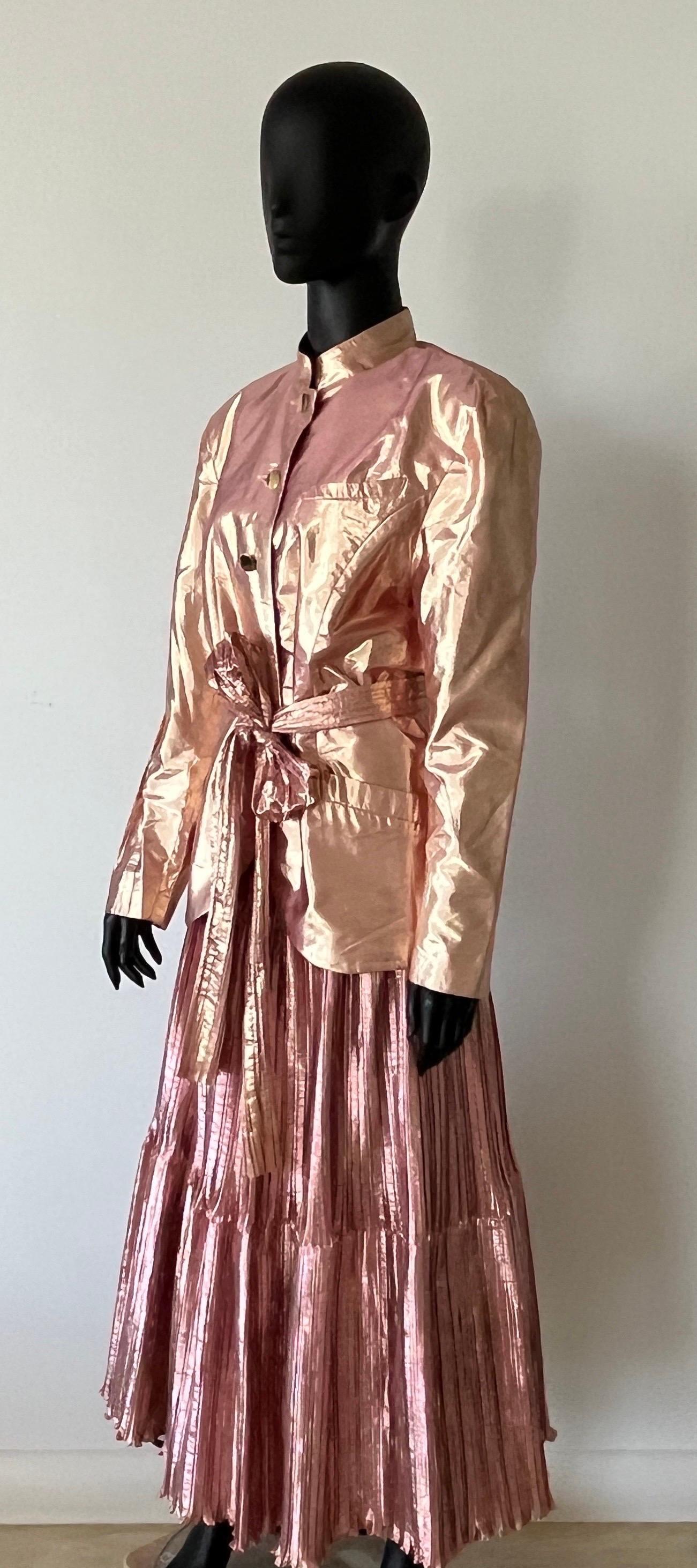 Amazing John Cavill metallic plisse 4 piece suit comprising of jacket over full length matching fabric skirt with net petticoat and belt makes this a stand out outfit.

An eye catching and extraordinary outfit for any event

A special suit from this