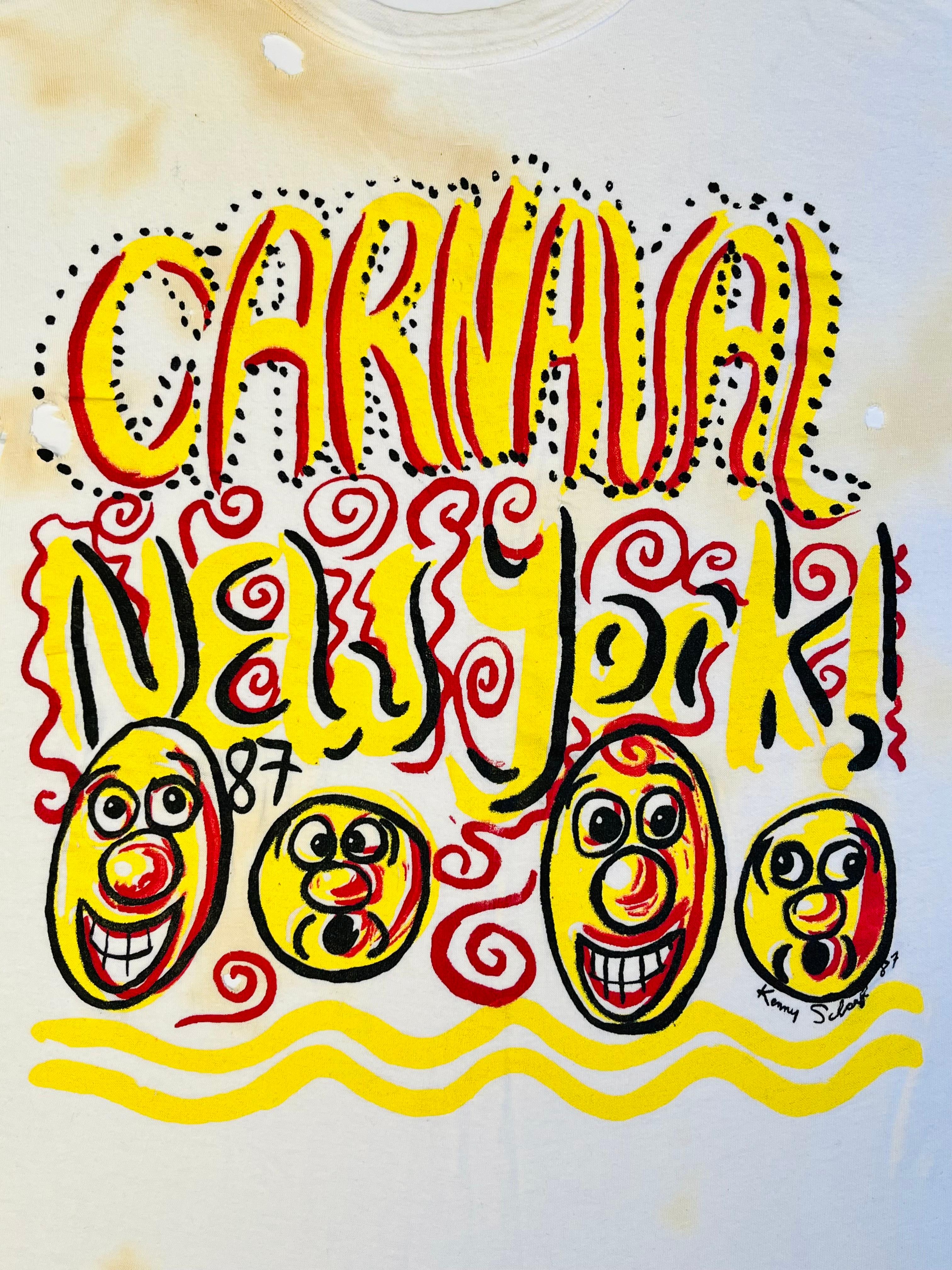 Camiseta vintage ilustrada de Kenny Scharf de 1987:
Camiseta icónica y original de Kenny Scharf de los años 80, diseñada por el artista para promocionar el 