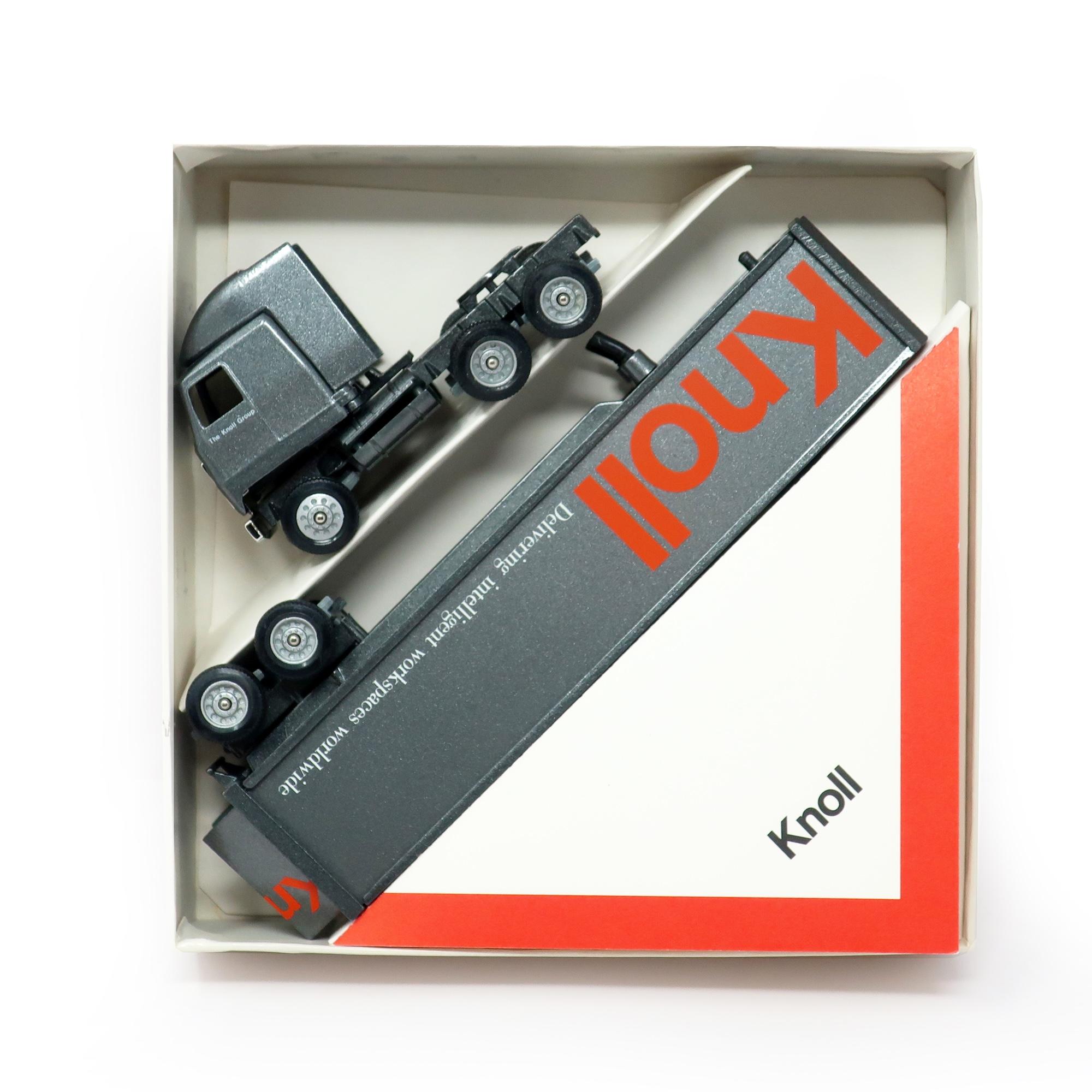 A fun Knoll Furniture miniature die-case truck made by Winross.  Given to Knoll's vendors as a gift, it is a 1:64 scale model with removable cab and trailer with metal and plastic parts.  Charcoal grey paint on cab and trailer with iconic red Knoll