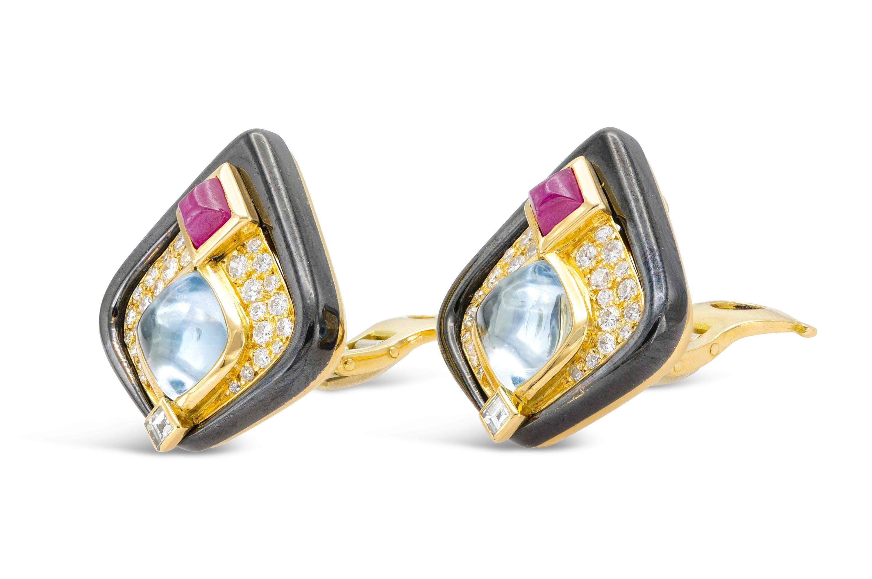 Finely crafted with black enamel over 18k yellow gold with Cabochon Aquamarines, Sugarloaf Rubies, and Round Brilliant cut Diamonds.
Signed by Marina B
Circa 1980s
Made in France