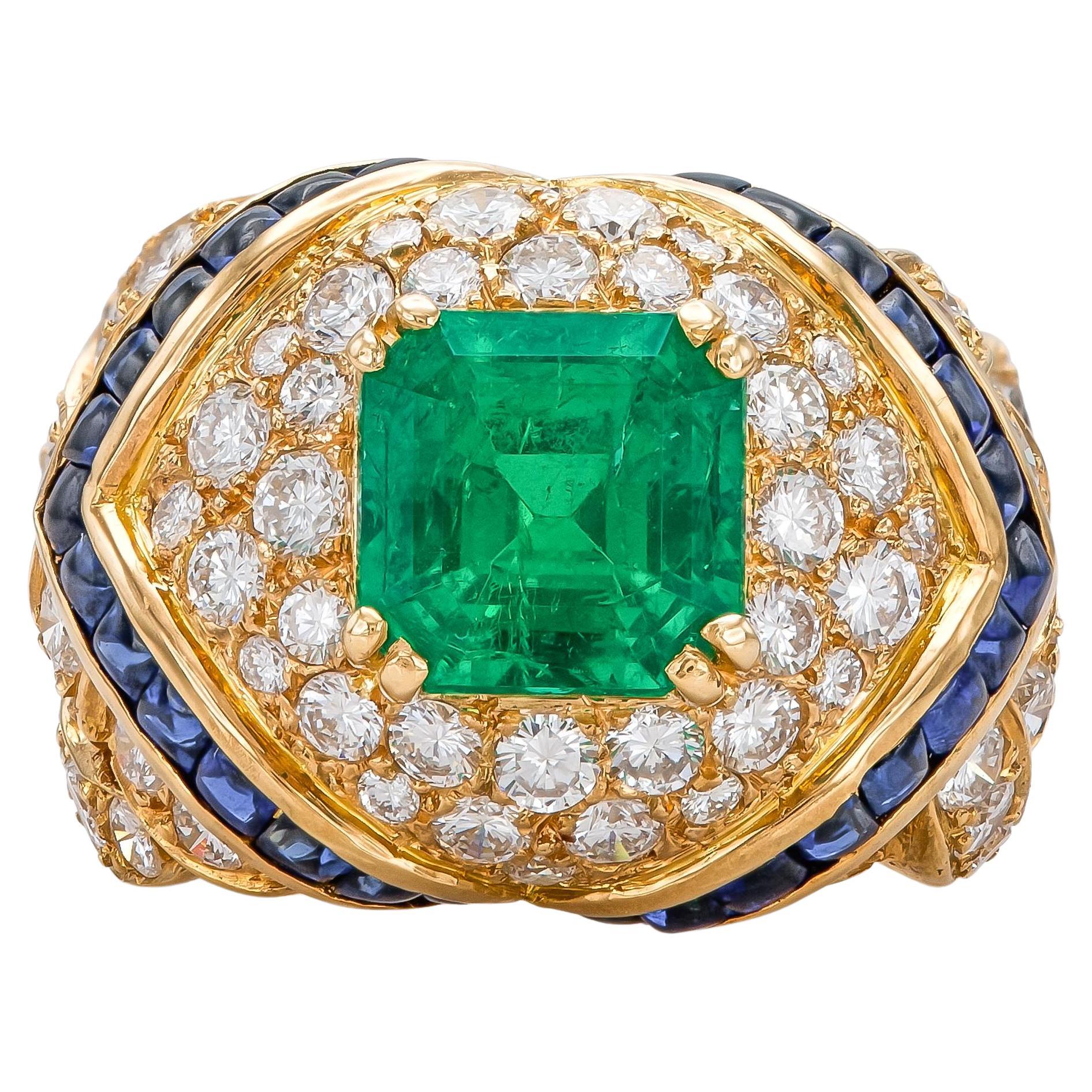 Vintage 1980s Mauboussin Emerald Ring with Diamonds and Sapphires For Sale