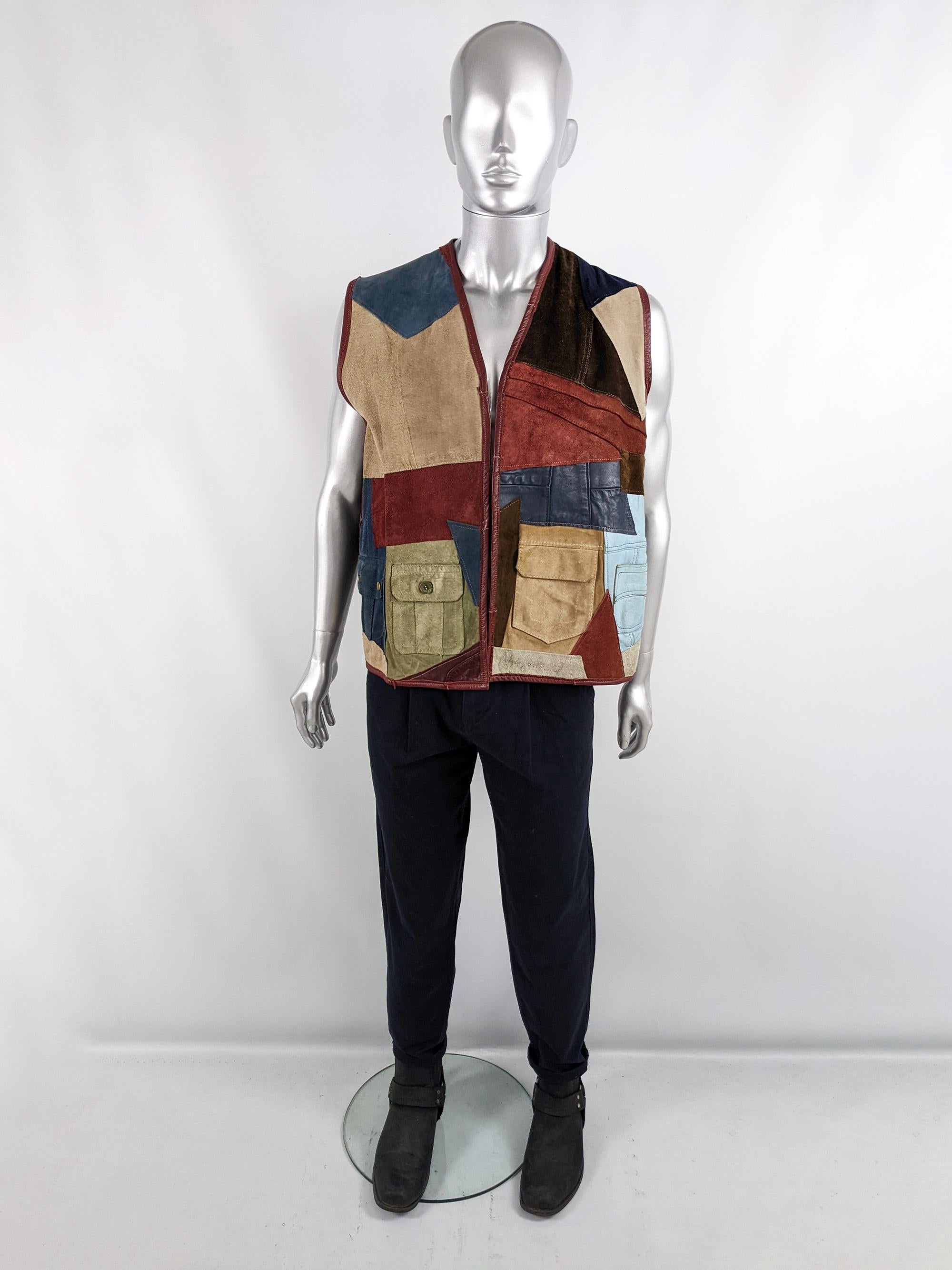 An incredible and rare vintage mens jacket from the 80s by Scrap Scrap. Has been reconstructed in the 1980s from a patchwork of 70s and 80s leather and suede jackets with several pockets.

Size: Unlabelled; best fits a mens Large to XL
Chest - 44” /
