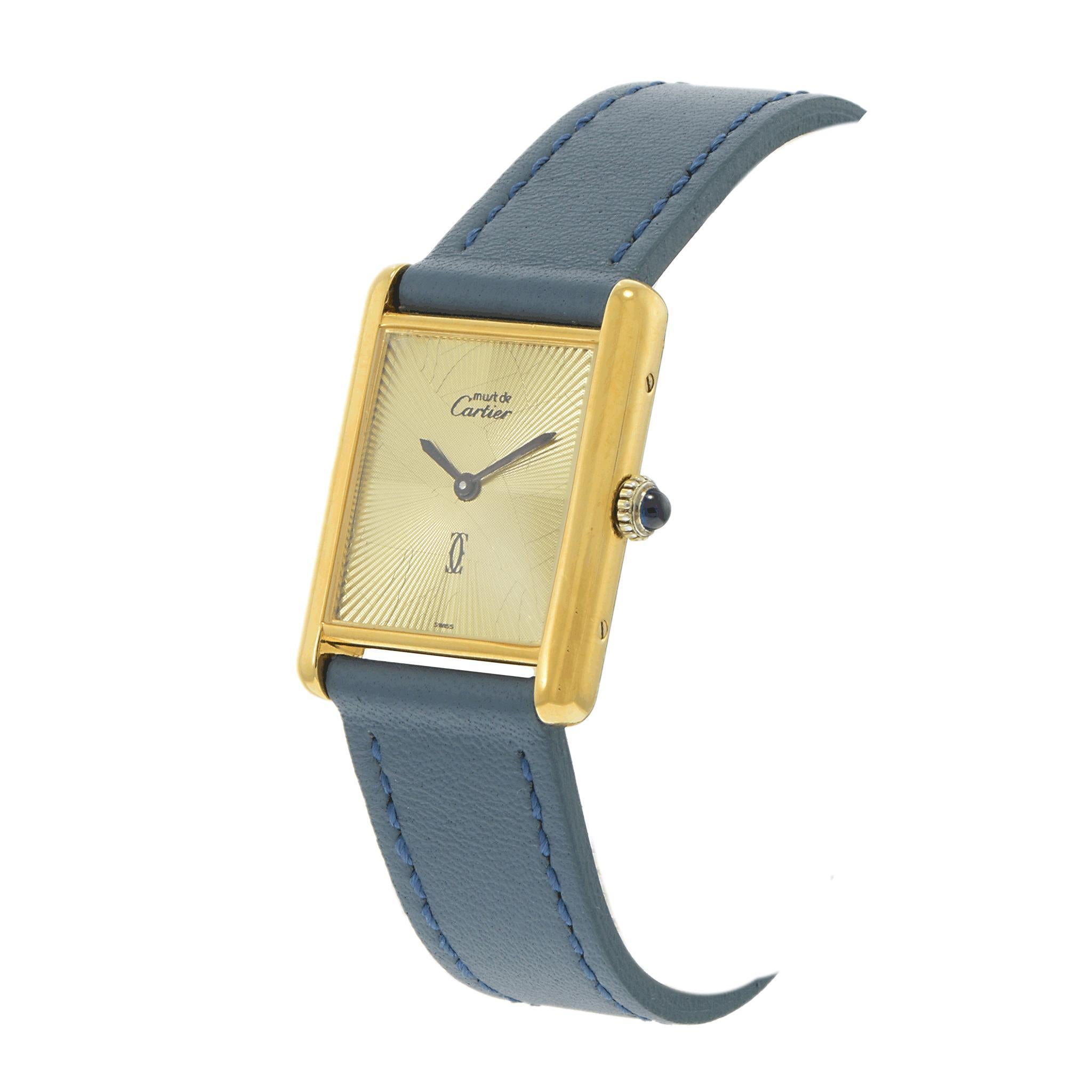 A refined 1980s Must de Cartier Paris timepiece, featuring a 23.5mm x 30.5mm .925 sterling silver vermeil case with 18K gold plating, exuding Cartier’s signature elegance. The sunburst guilloché dial adds depth and texture, beautifully complemented