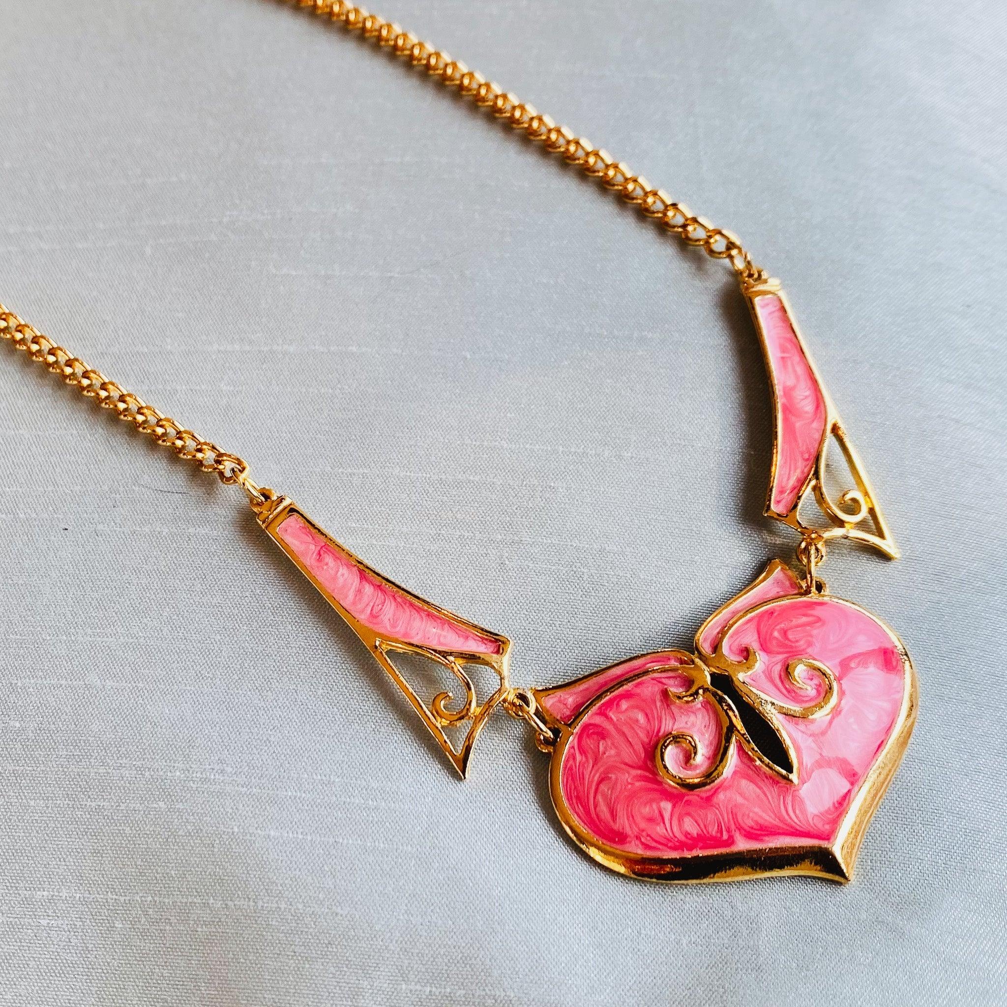 Vintage 1980s Necklace

Meet this incredible vintage 1980s necklace, made in the UK from 18 carat gold plate and inlaid with barbie pink enamel.

This necklace is a deadstock item, made in the 1980s but remained packaged up and unworn. This necklace