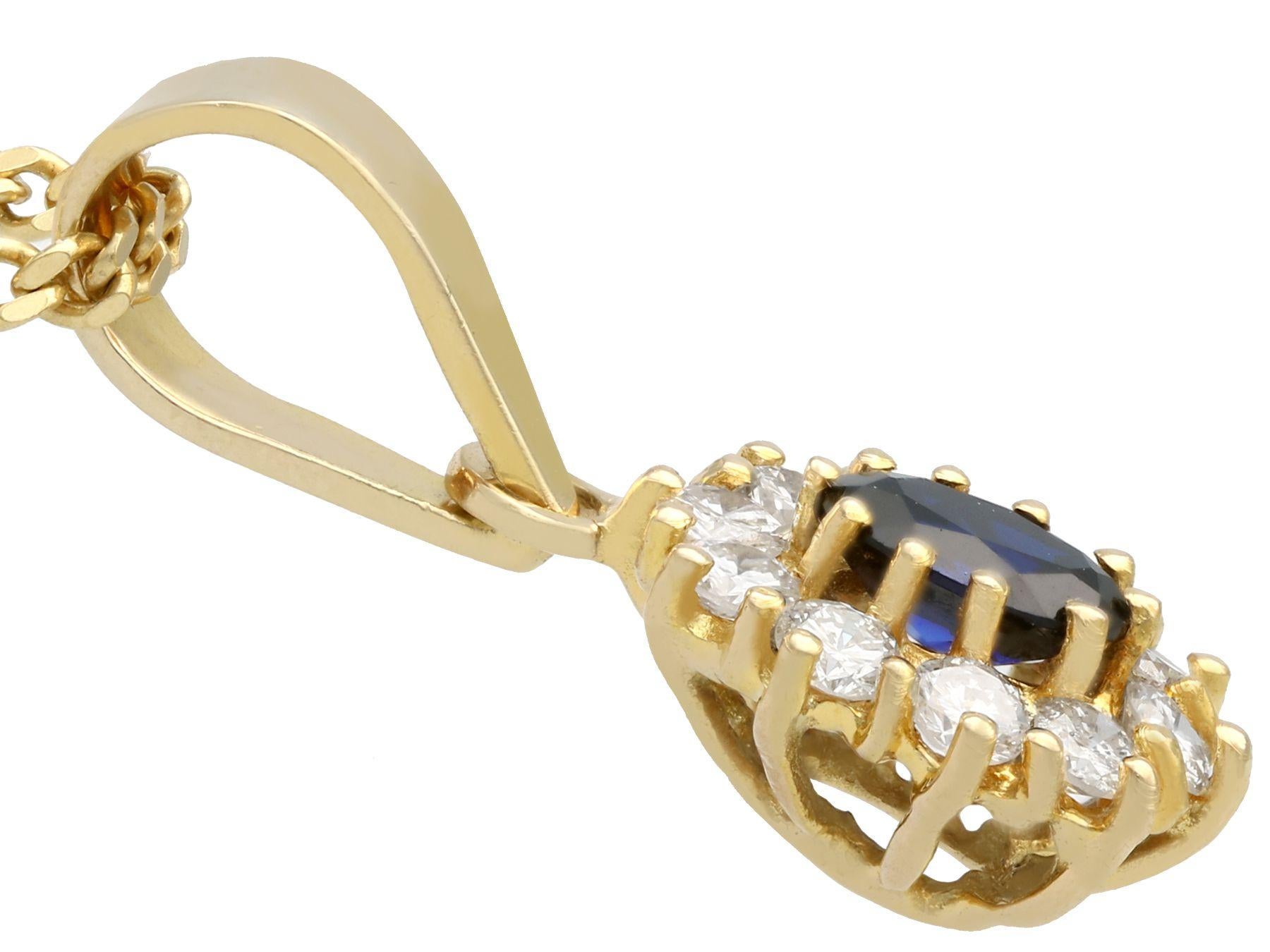 Women's Vintage 1980s Oval Cut Sapphire and Diamond Yellow Gold Cluster Pendant For Sale
