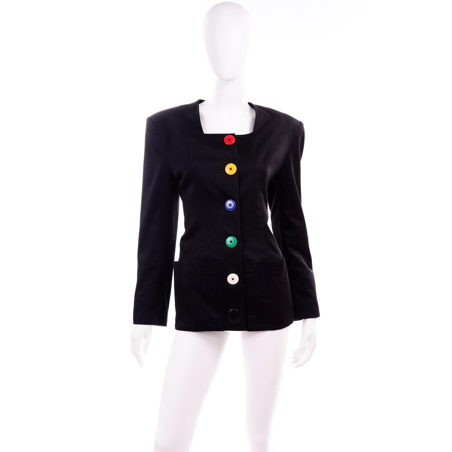 This is a fabulous vintage Patrick Kelly black jacket with multi colored buttons up the front and on the cuffs. This 1980's black cotton blazer has shoulder pads and is lined in a rayon blend. The buttons are in shades of yellow, green, red, white,