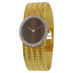 Vintage 1980s Piaget 18KT Gelbgold Tigerauge Zifferblatt Diamant Lünette Uhr