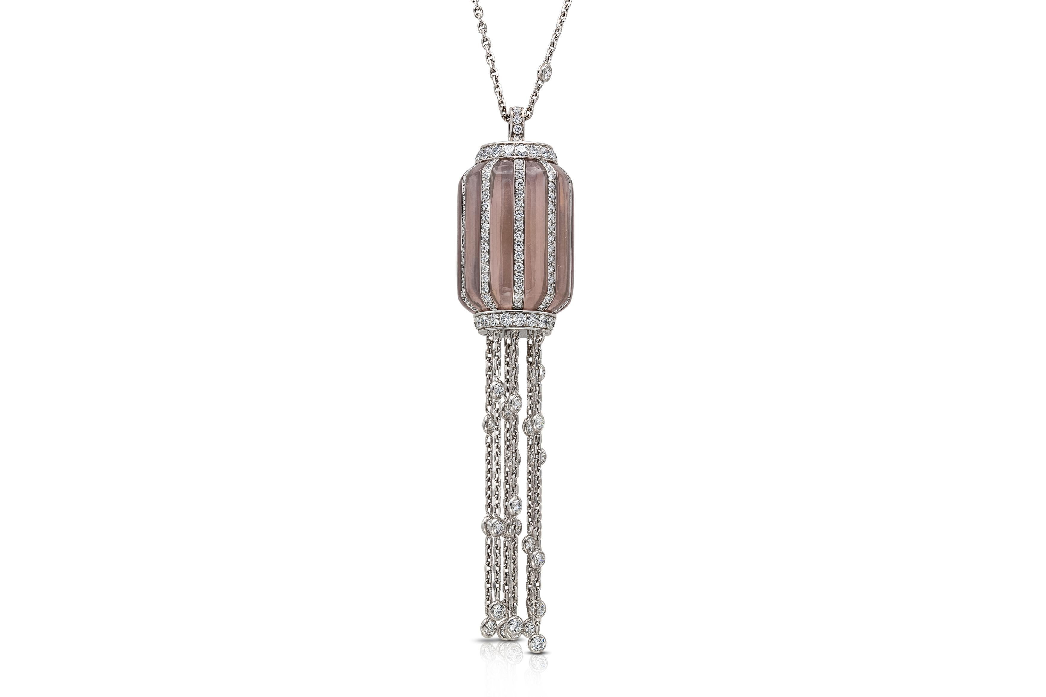 Finely crafted in platinum and 18k white gold with Rose Quartz and Round Brilliant cut Diamonds weighing approximately a total of 15.00 carats.
Signed by Piaget
Circa 1980s
The Diamonds by the yard chain is 29 inches long, the Rose Quartz pendant