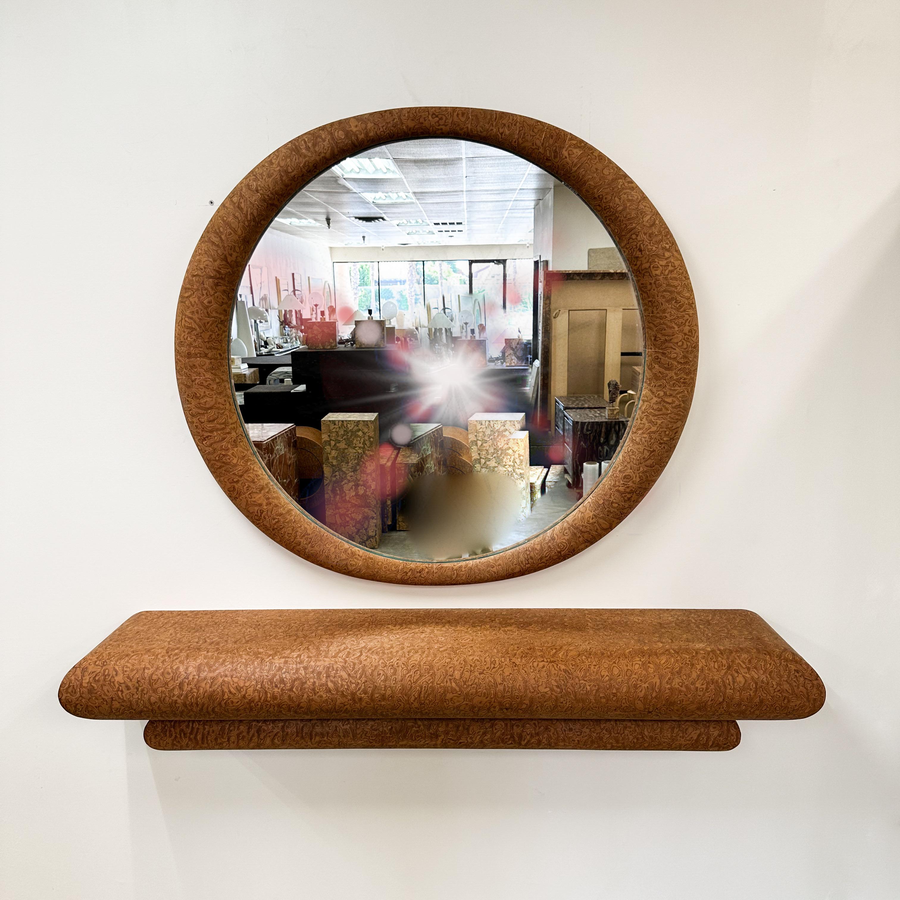 1980s Postmodern floating console and mirror set.

The console features a distinctive double bullnose profile, with the larger curve resting above the smaller for a sculptural, architectural effect. Its wall-mounted form creates a refined floating