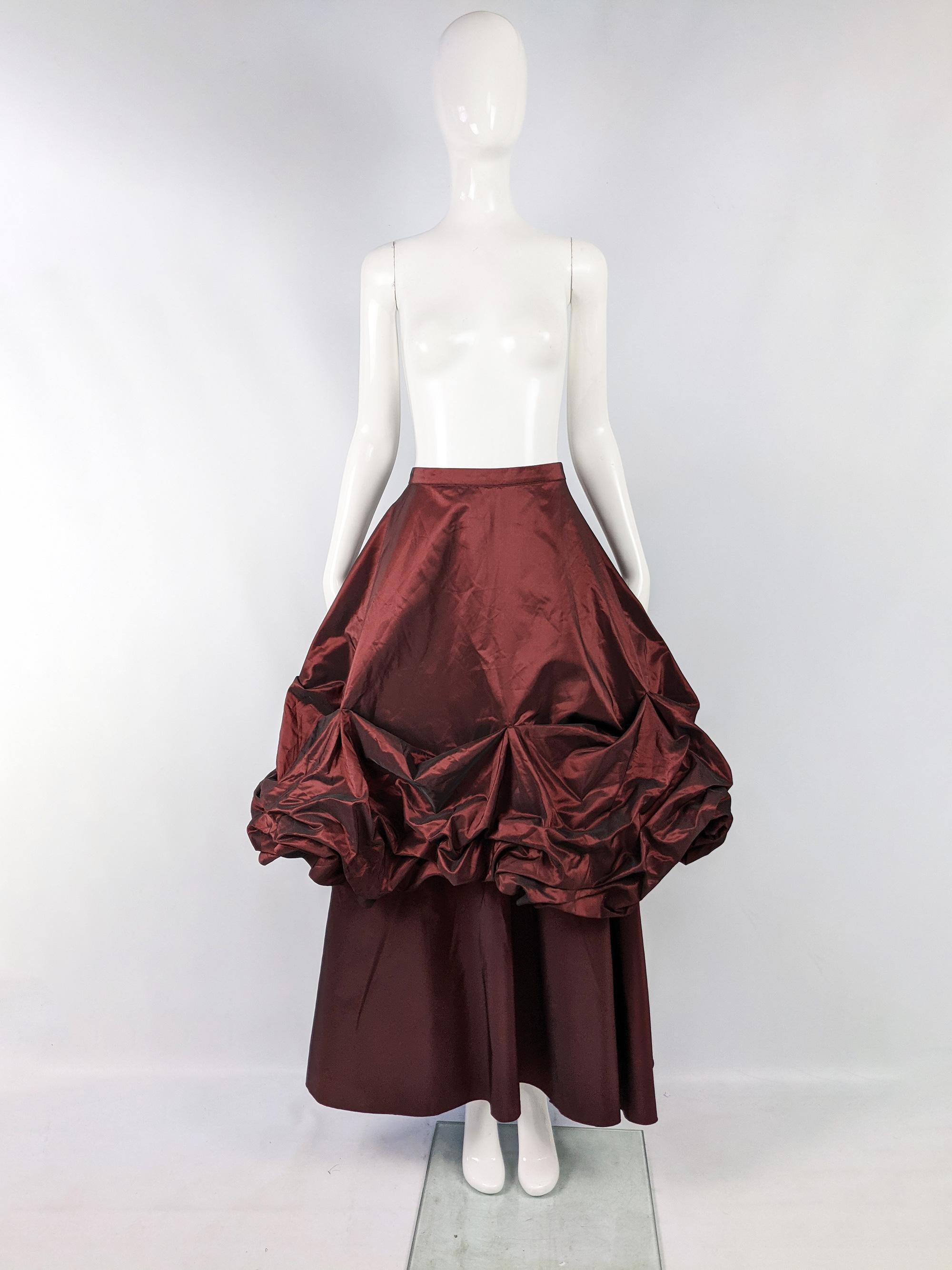An absolutely incredible vintage womens maxi length evening skirt from the 80s in a red iridescent taffeta fabric with an incredible ruched huge top skirt over a long A line skirt. Makes a dramatic, avant garde statement at any formal party. 

Size: