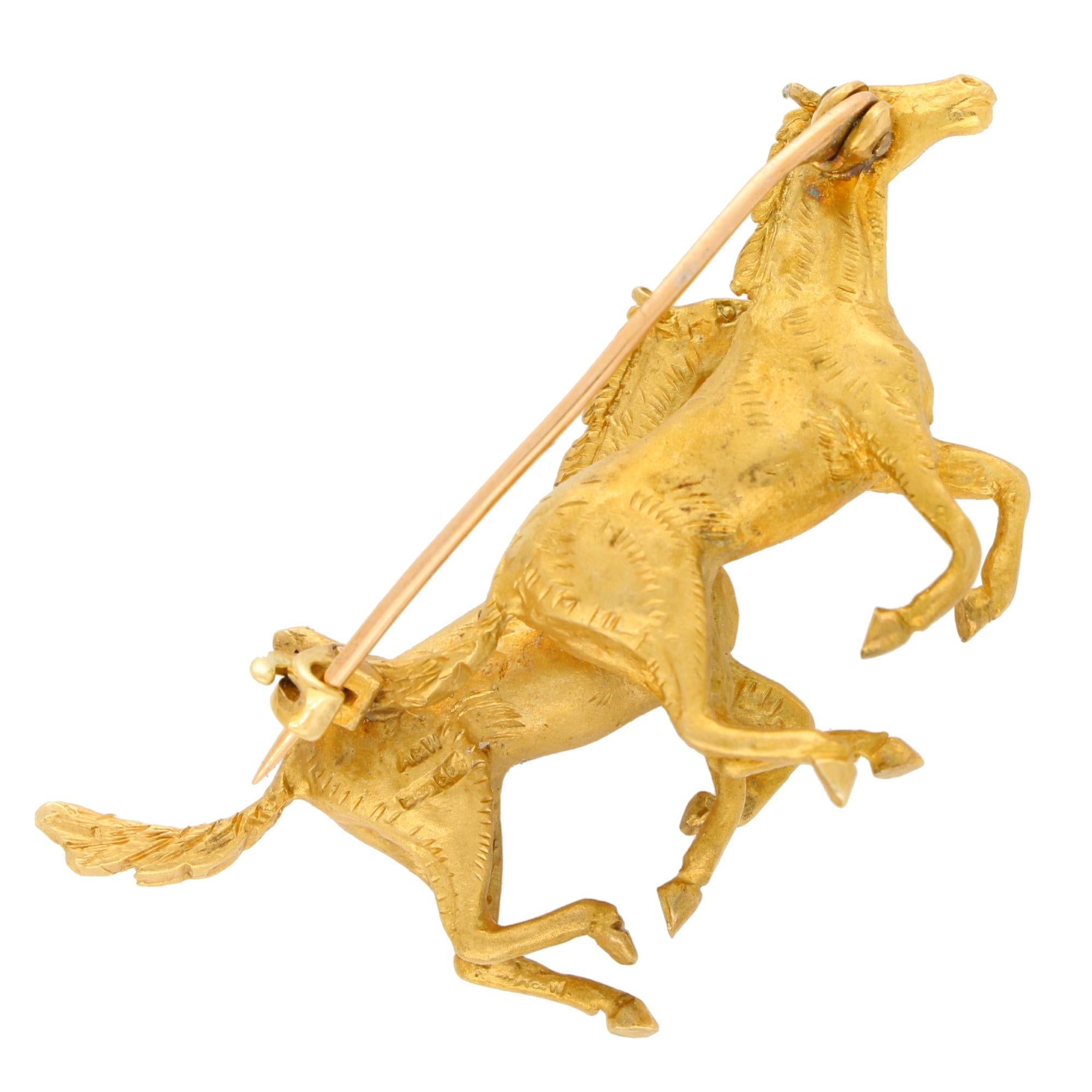 A stylish vintage 1980's horse brooch, in solid 9k yellow gold. 

The brooch depicts two running horses, carved to depict naturalistic features. The brooch is secured to reverse with a pin and roller clasp fitting. 

Due to the size, this brooch