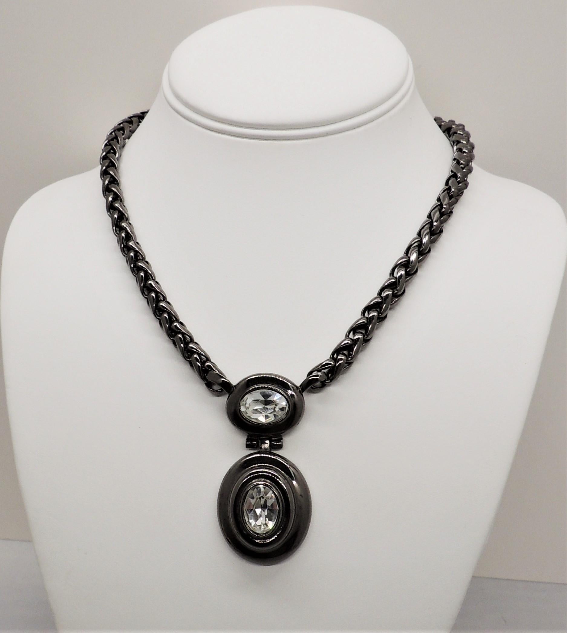 1980s hematite finish metal with two oval clear rhinestones pendant necklace with GG Givenchy clasp. Marked 