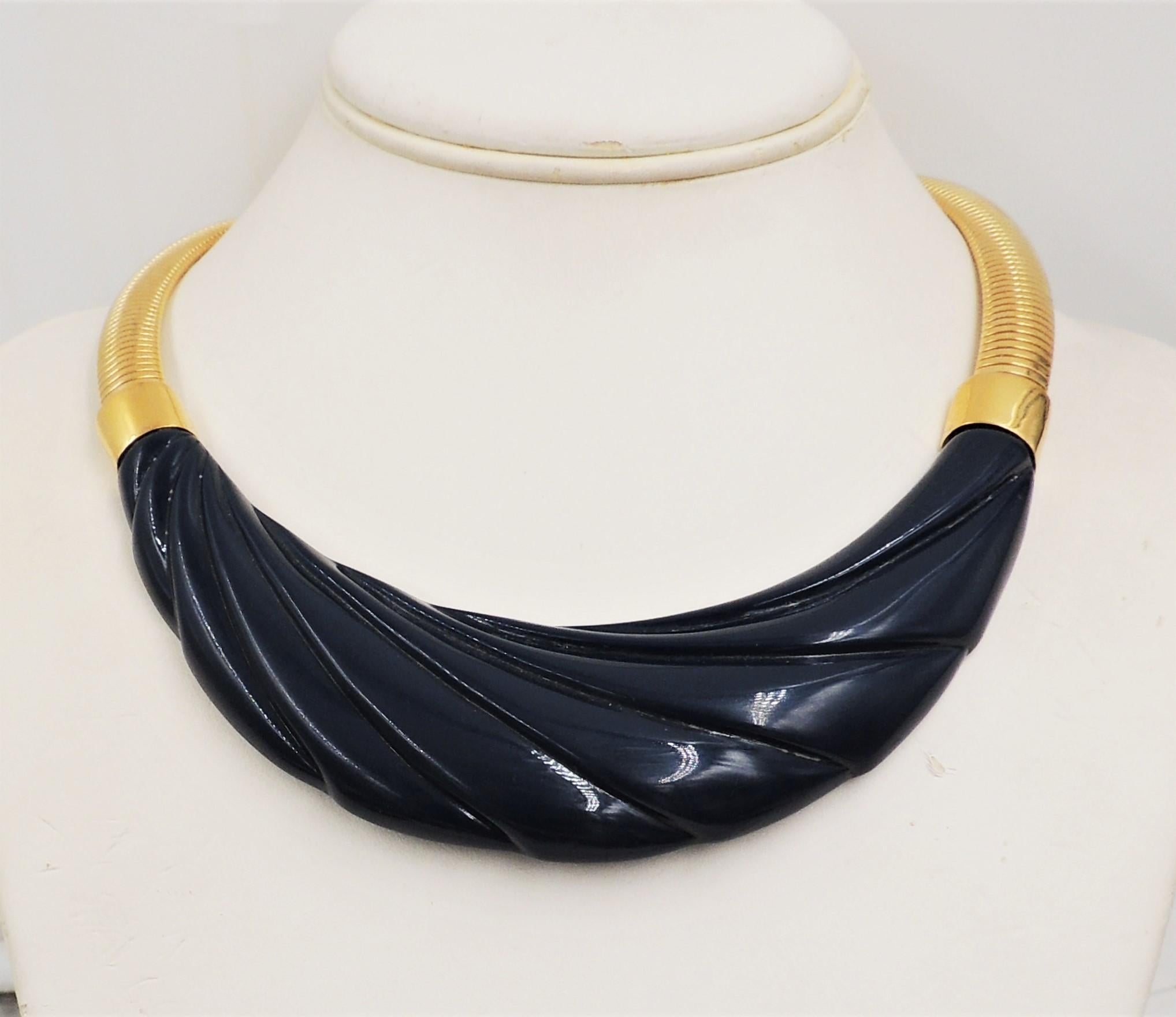 1980s goldtone and molded blue Lucite collar necklace with fold over clasp. Marked 