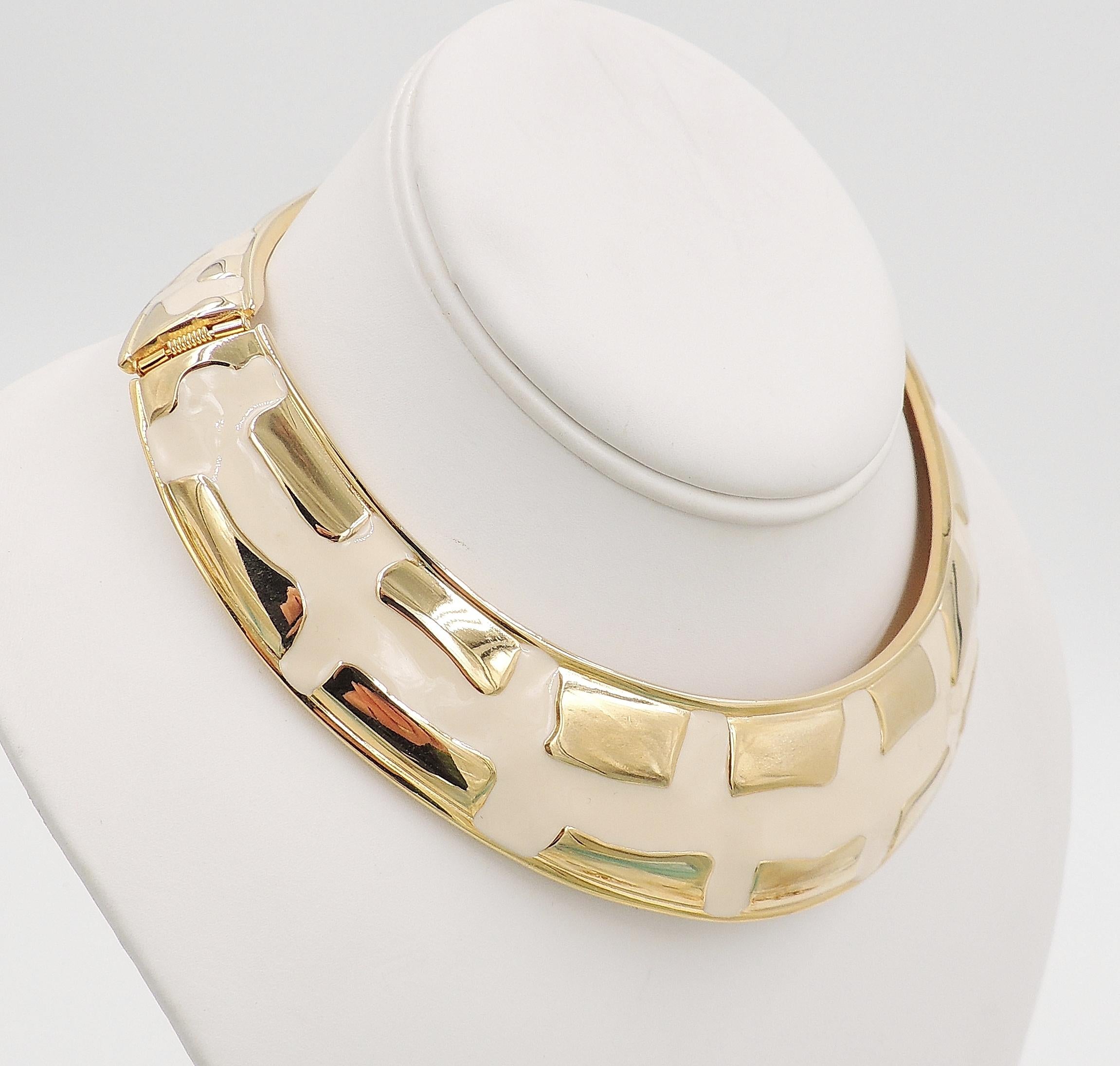 Circa 1980s modernist yellow gold plated and white enamel hinged collar necklace. Marked with Valentino Garavani's 