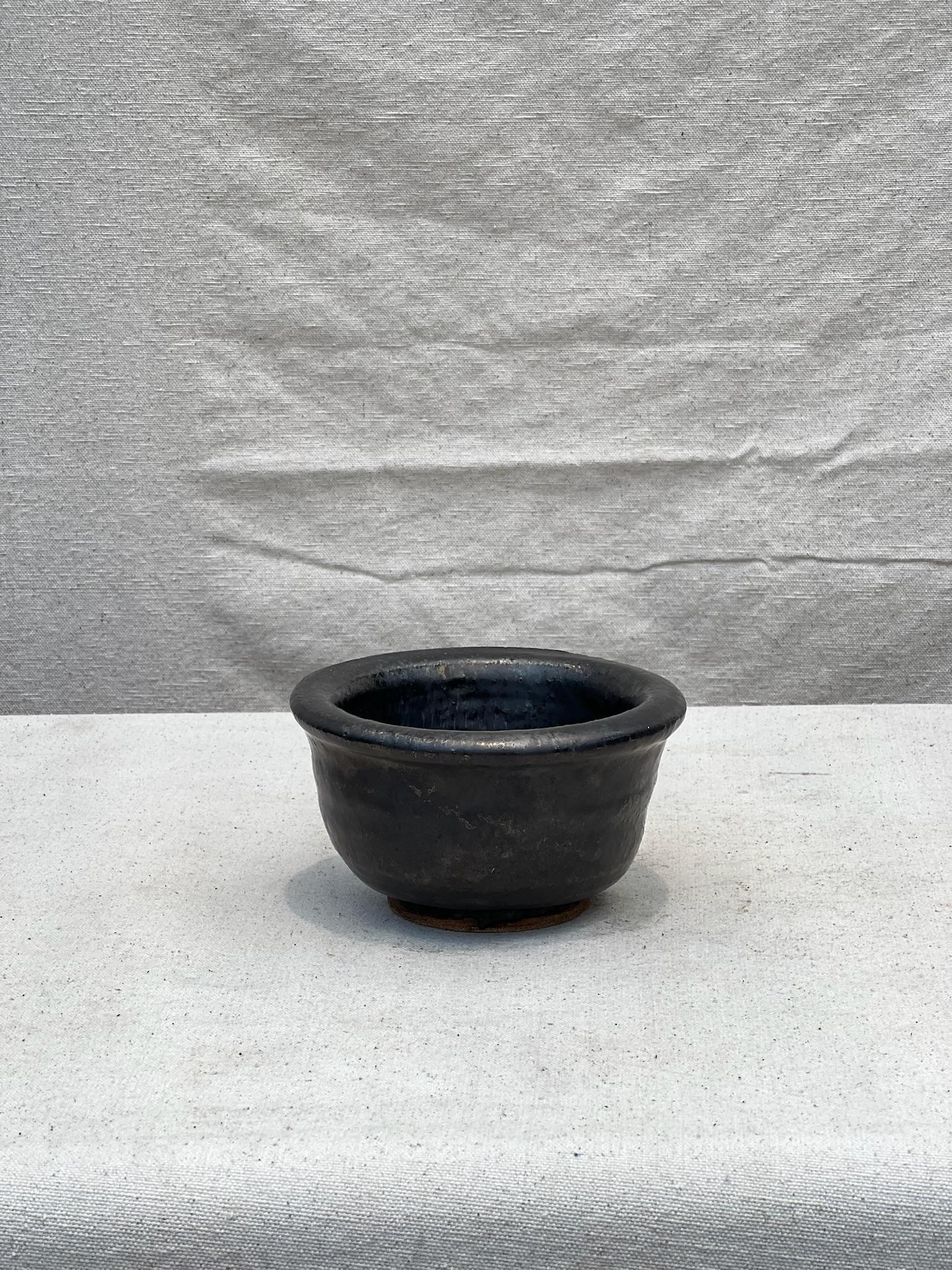 Exquisite small black vintage Asian bowl in timeless black – collectible décor piece.
