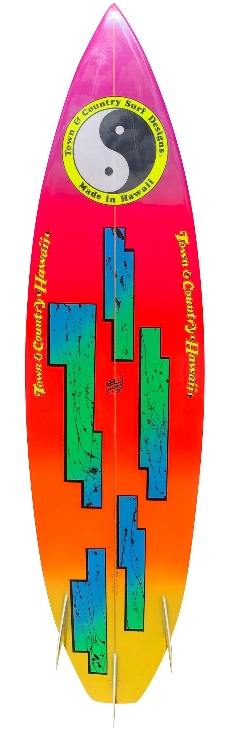 1987 Town & Country thruster (tri-fin) short board surfboard shaped by Greg Griffin. Features a stunning 1980s airbrush design with glassed on fins. This surfboard has been fully restored by a restoration expert with over 40 years of experience. An