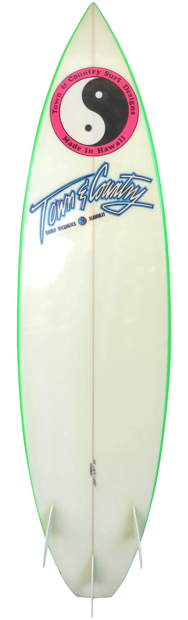 Late 1980s Town & Country (T&C) surfboard shaped by Dennis Pang. Features a vibrant airbrush fade design on deck with candy apple green rails and glassed on thruster (tri-fin) setup. It's extremely difficult to find such a well preserved vintage T&C