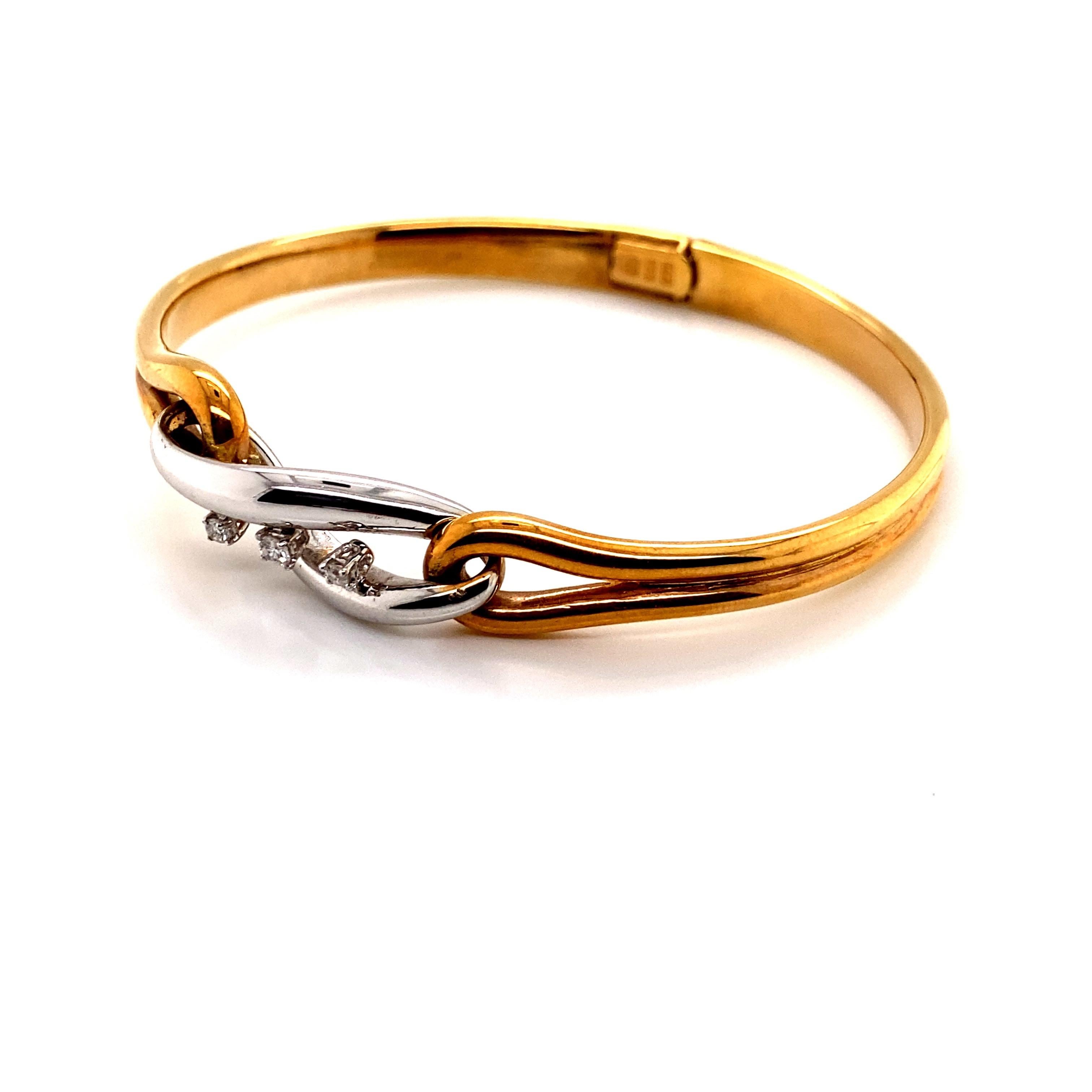 Vintage 1980's Two Tone 14K Gold Bangle Bracelet with Three Diamonds - The Italian made bangle contains 3 diamonds that weigh about .10ct total weight with H color and VS2 clarity. The top of the bangle is white gold and it is attached to yellow