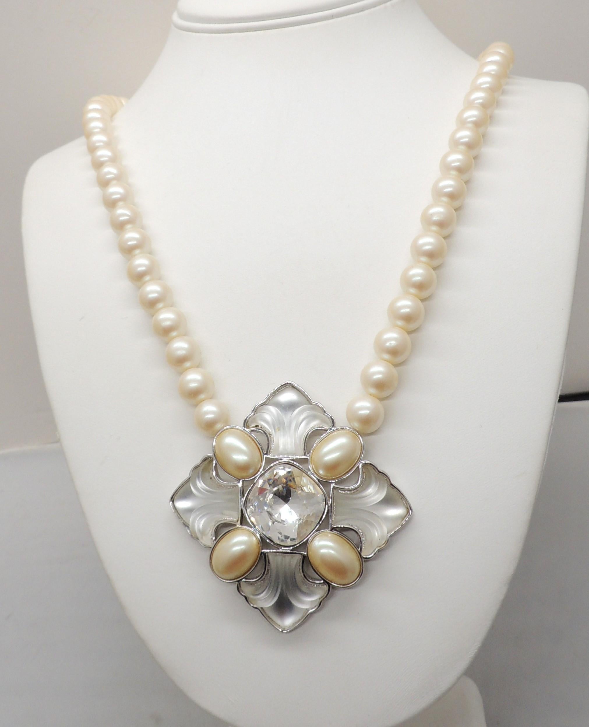 1980s rhodium plated  pendant with square cut Swarovski center rhinestone with oval faux-pearl and molded clear resin surround on a faux-pearl chain with hook clasp. Marked 