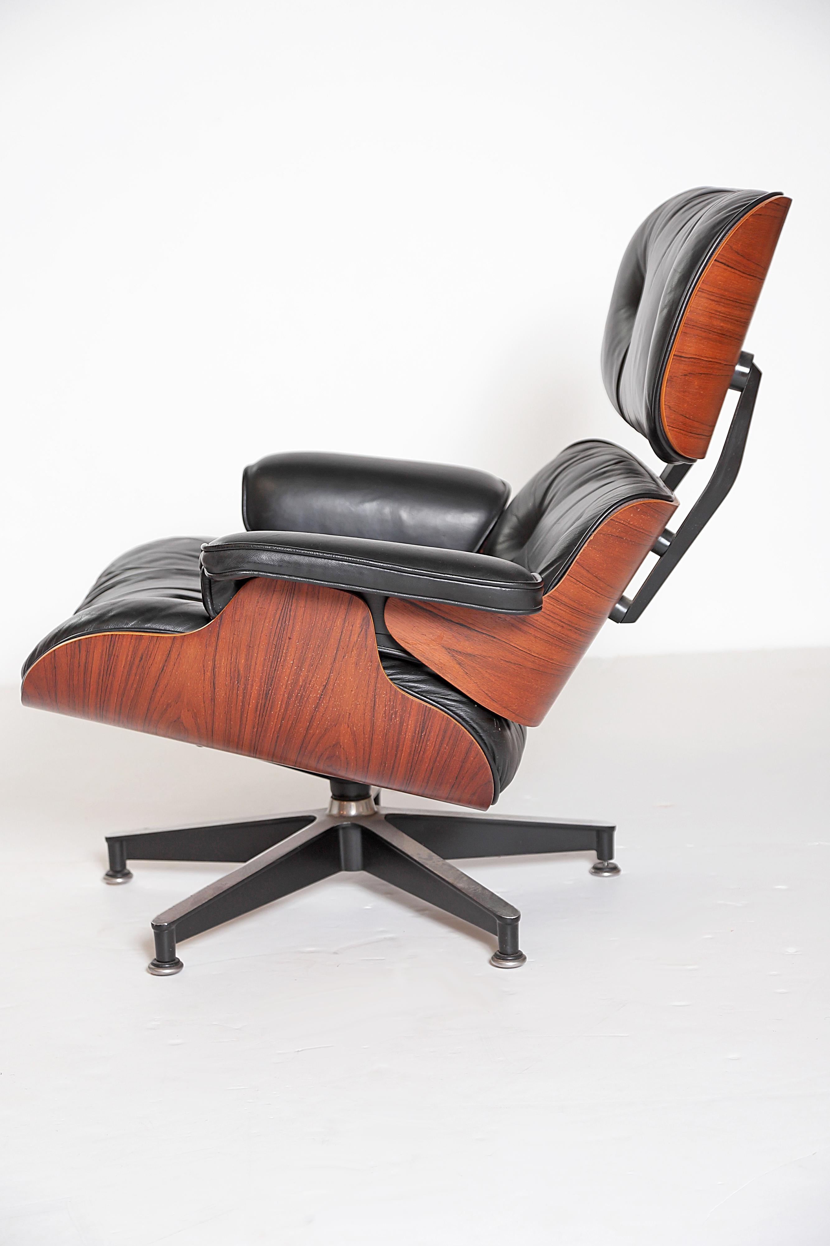 Vintage 1983 Eames Lounge Chair and Ottoman of Rosewood and Black Leather 1