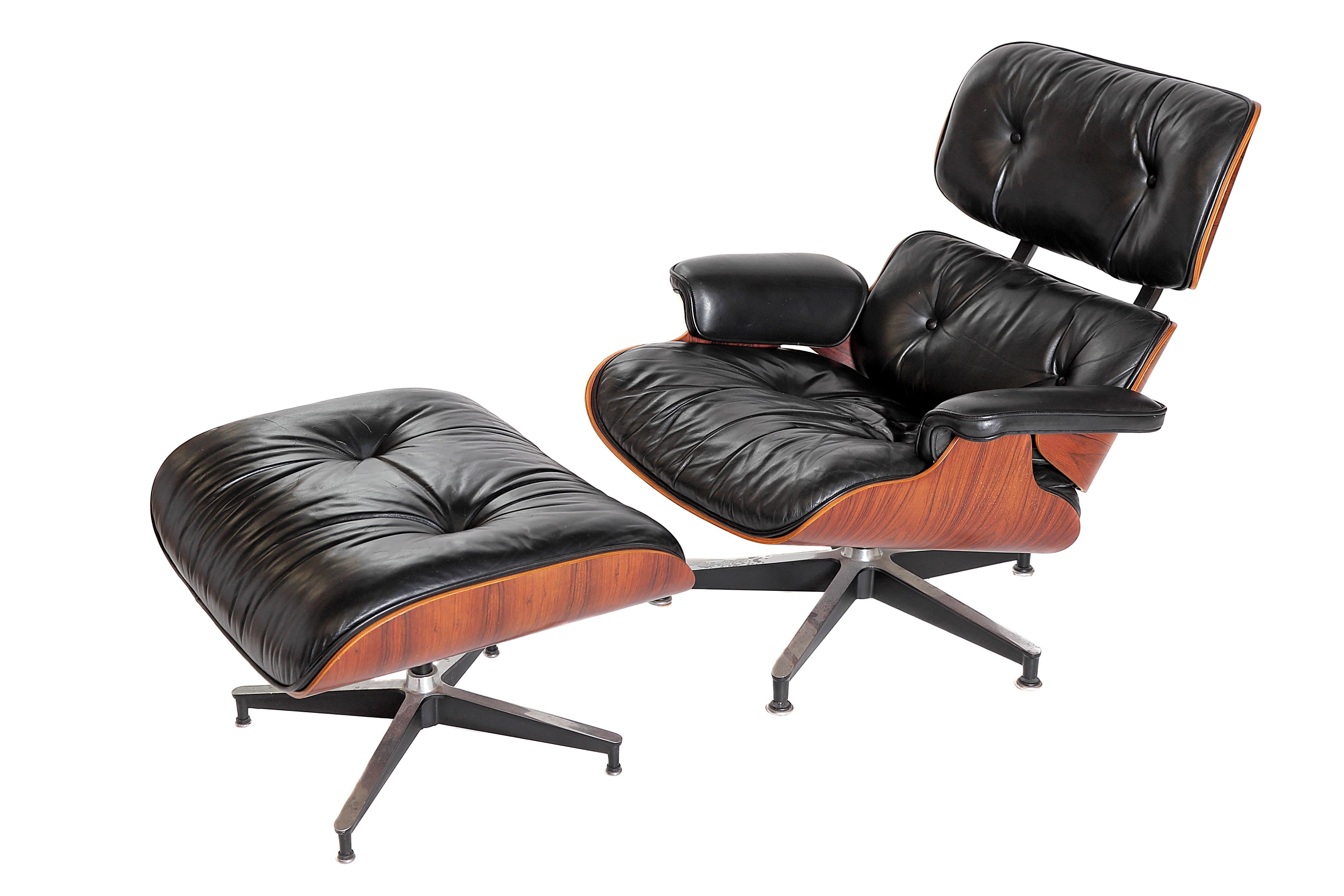 Eames lounge chair and ottoman in rosewood and black leather, circa 1983. Purchased from the original owner, tags intact on both the chair and ottoman.

**NOTE: This item is made with Brazilian Rosewood veneers and CANNOT be exported from the United