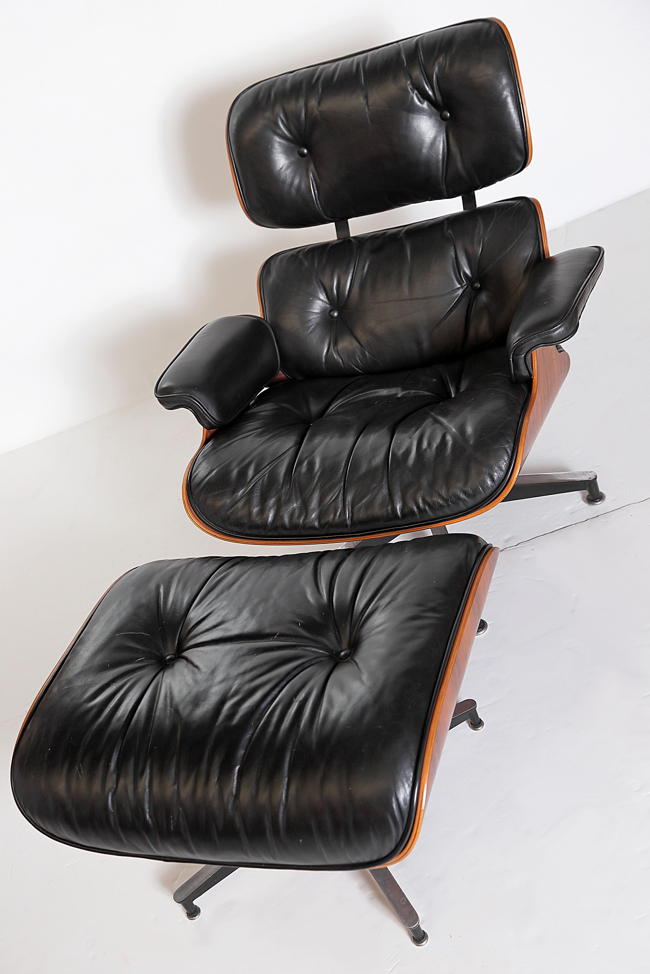 Mid-Century Modern Vintage 1983 Eames Lounge Chair and Ottoman of Rosewood and Black Leather