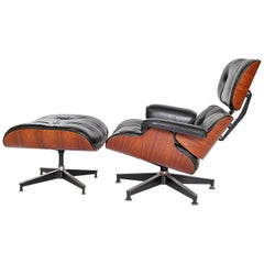 Vintage 1983 Eames Lounge Chair and Ottoman of Rosewood and Black Leather