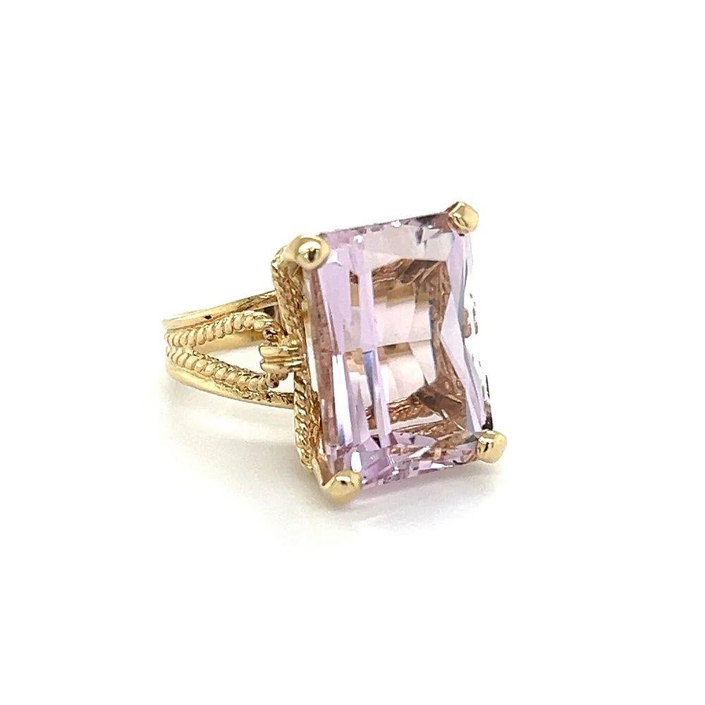 Simply Beautiful! Rectangular Fancy cut Kunzite Solitaire Cocktail Gold Ring. Centering a securely Nestled Hand set Impressive Rectangular Fancy cut Kunzite, weighing approx. 19.84 Carats. Finely Hand-crafted 14K Yellow Gold Wrapped Rope mounting.
