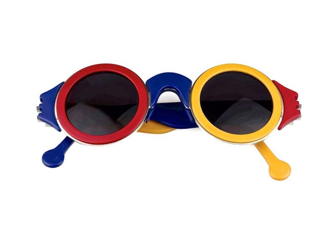 Vintage 1985 KARL LAGERFELD Limited Edition Colour Block Sunglasses

Measurements:
Frame Height: 2 inches (5.08 cm)
Hinge to hinge Width: 5 4/8 inches (13.97 cm)
Temples: 5 4/8 inches (13.97 cm)

Only 2000 pieces were made. This is numbered 0559/