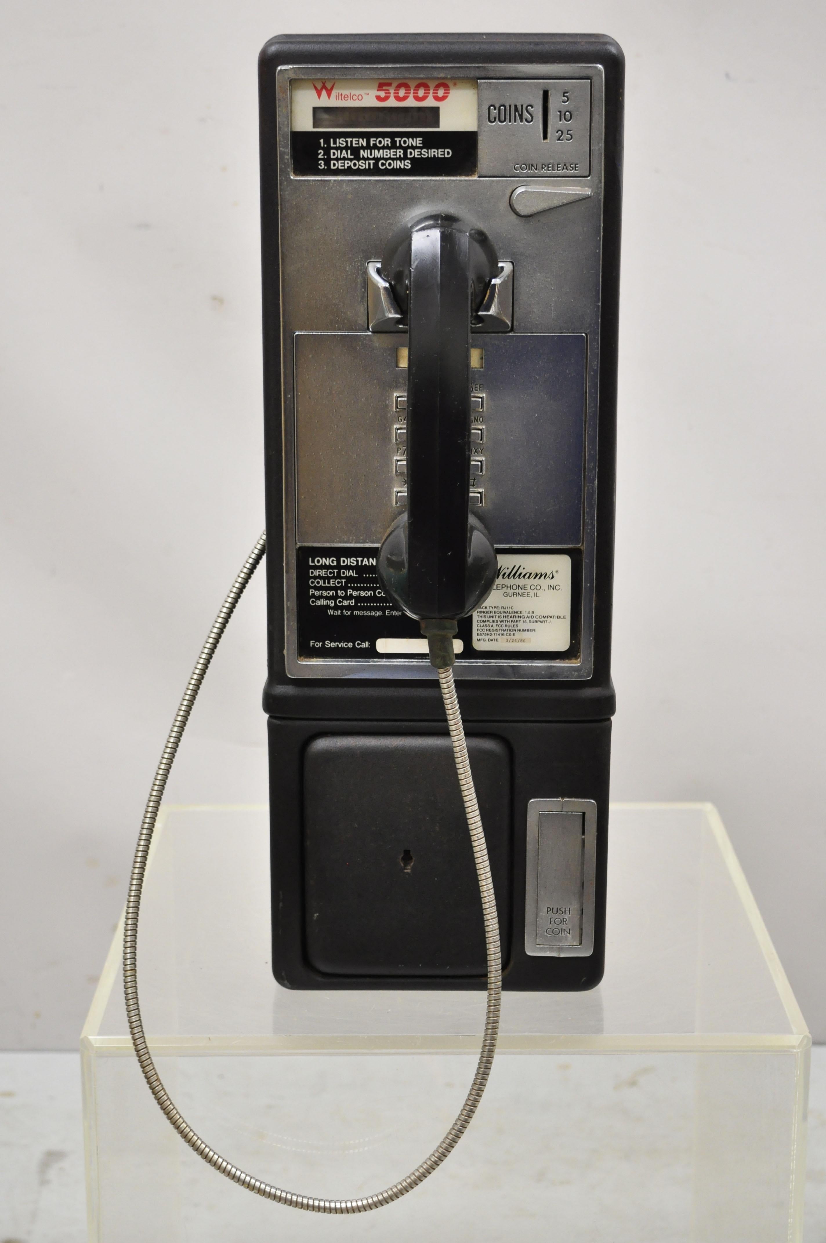 Vintage 1986 Wiltelco 5000 Williams Telephone Co. Intelligent Pay Phone Coin Op. Item features heavy cast iron construction, very rare vintage model, original label, very nice vintage item, quality American craftsmanship, great style and form.