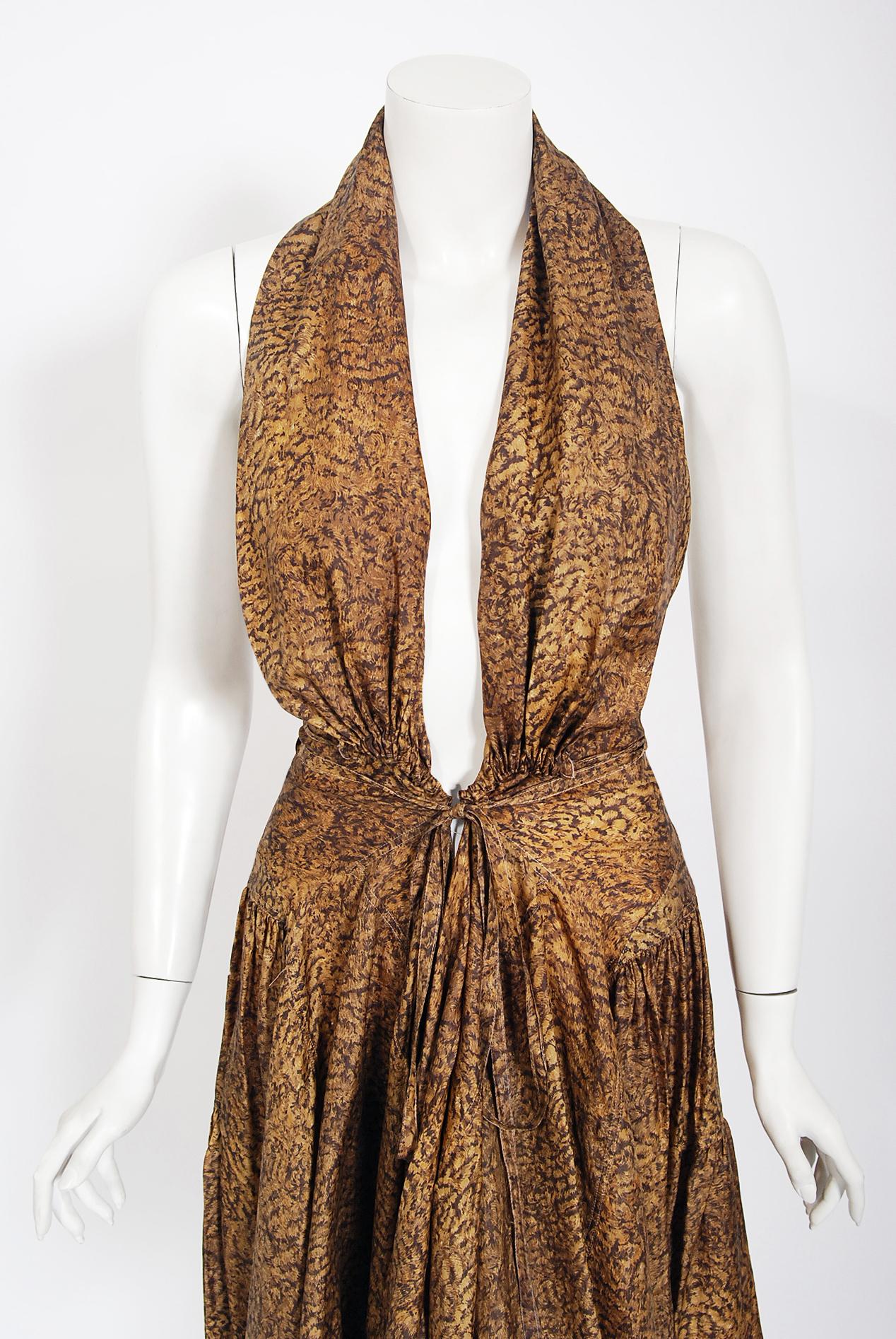 An iconic golden marble print silk dress from Azzedine Alaia's 1987 Spring-Summer collection. The same dress was famously worn by Madonna for the cover of Cosmopolitan Magazine July issue. In the 1980's when most of the fashion world was embracing
