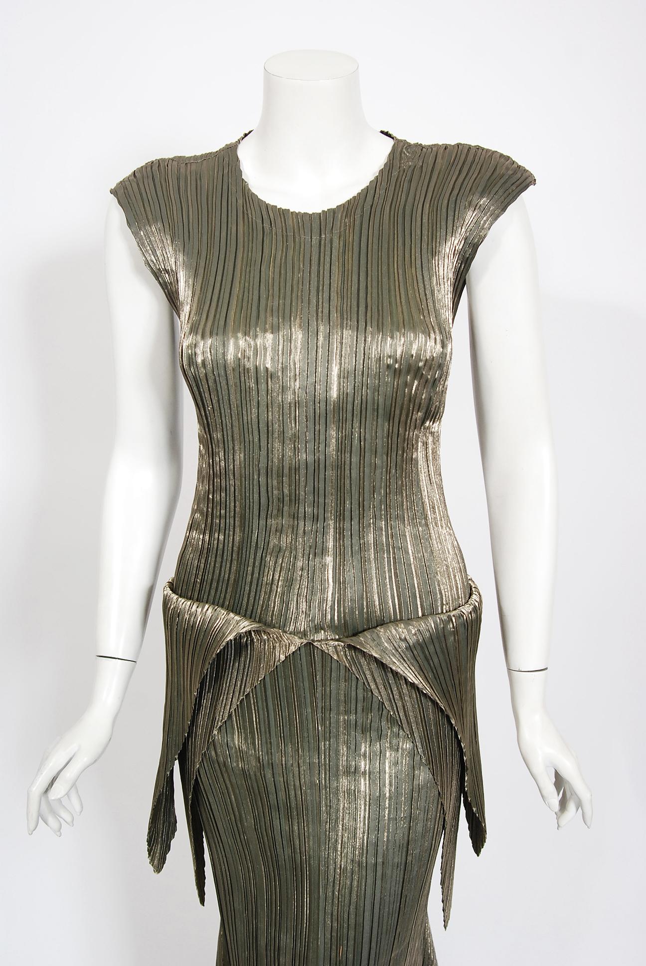 Gorgeous and highly desirable Issey Miyake metallic gold pleated sculptural dress set dating back to his museum held 1989-90 'Mercury Pleats' Collection. As one of the world's most innovative fashion designers, Issey Miyake experimented with new