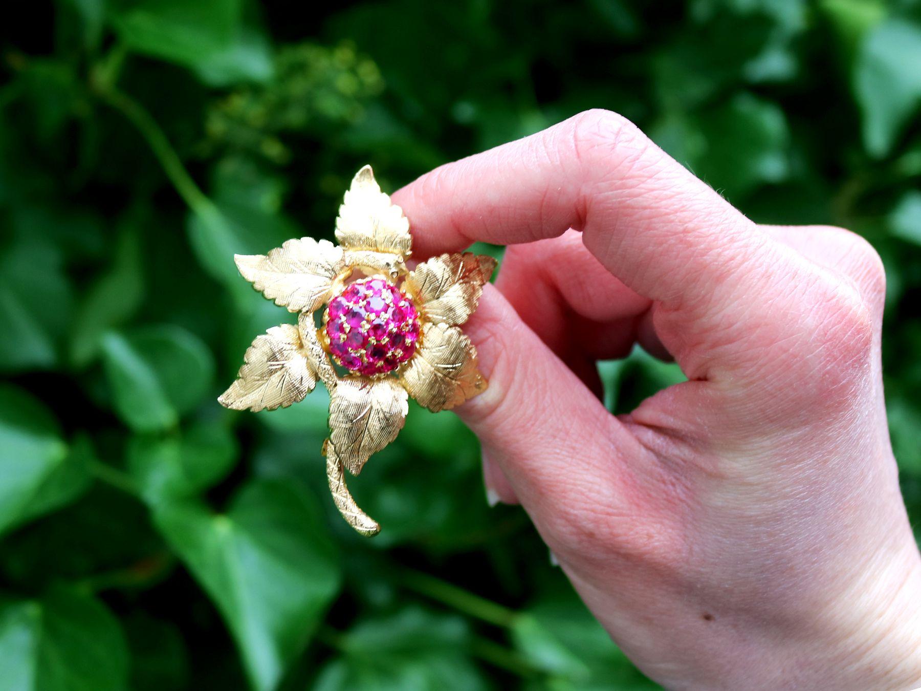 A stunning, fine and impressive vintage 1.83 carat Burmese ruby and 18 karat yellow gold floral brooch; part of our diverse vintage jewelry and estate jewelry collections

This stunning, fine and impressive 1990s vintage brooch has been crafted in