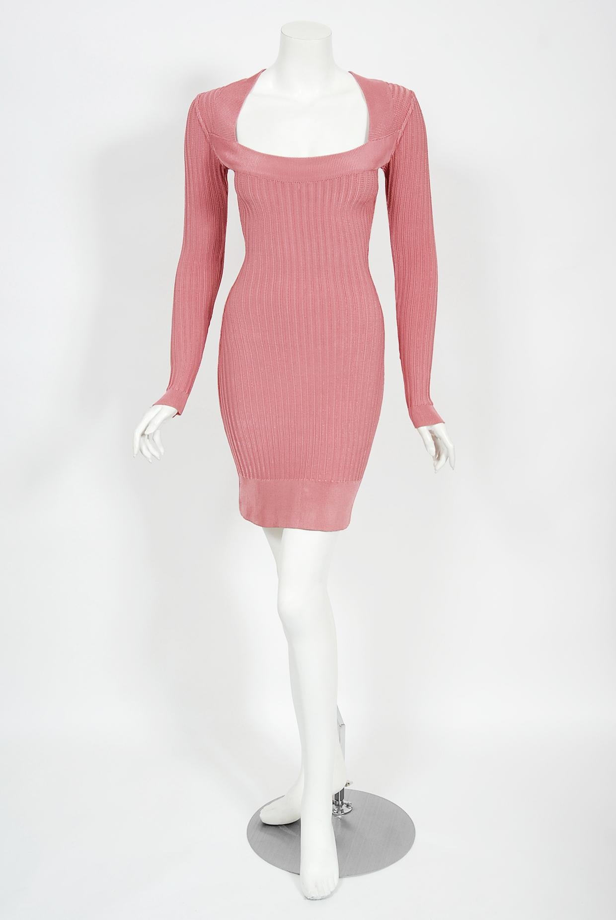 Iconic bodycon ribbed knit rayon dress from Azzedine Alaia's 1990 Fall/Winter runway collection. This blush-pink is such a beautiful and ultra rare color. Also a celebrity favorite; Nicole Richie wore this vintage dress to her premier in 2005!