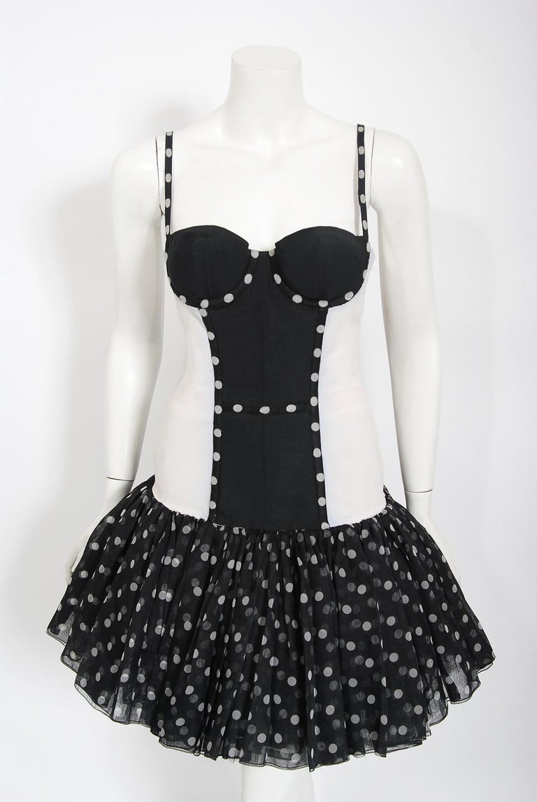 A stunning Christian Dior numbered Paris boutique polka-dot stretch hourglass dress dating back to the spring-summer 1990 collection. Christian Dior designed under his own name for only a decade, but his influence is everlasting. When the talented