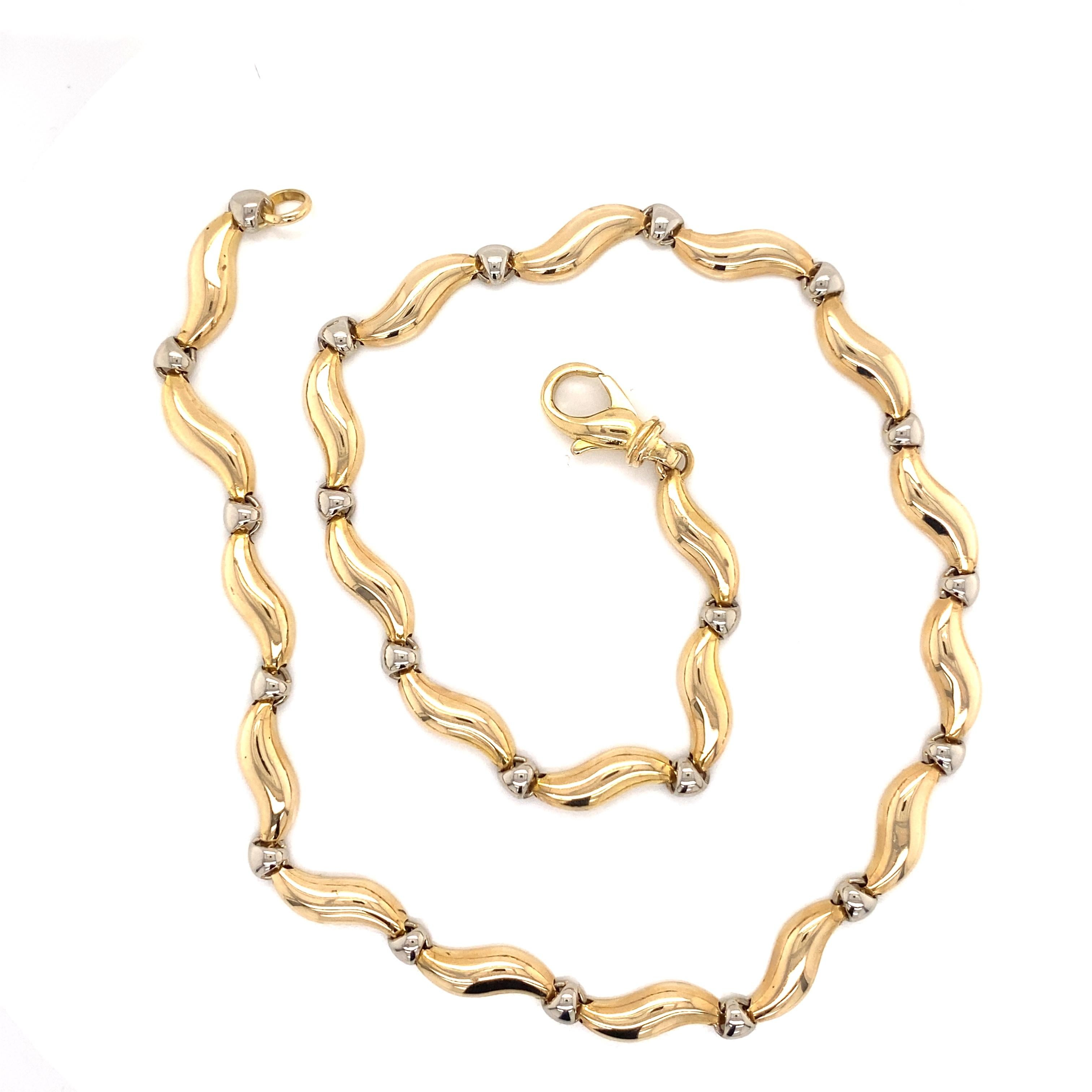 Vintage 1990’s 14K Yellow and White Gold S Link Necklace - The Italian made 2-tone gold necklace has alternating yellow gold modern S links connected by white gold round links. The necklace is 5mm wide and 16 inches long and features a beautiful