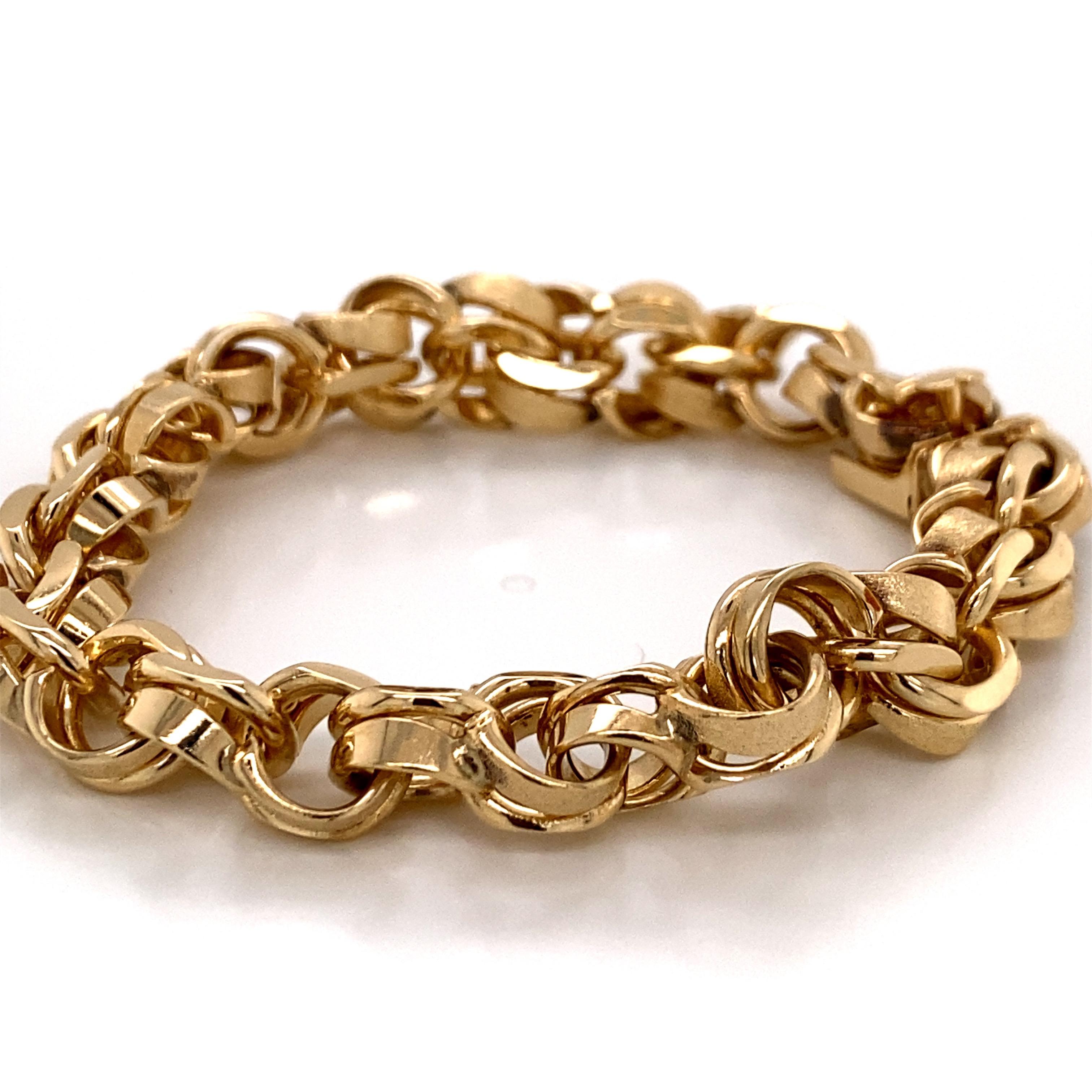 Vintage 1990's 14K Yellow Gold Heavy Charm Bracelet - The bracelet measure 7 1/4 inches long and 3/8 inches wide. It features a hidden barrel clasp with a figure 8 safety. The bracelet weighs 43.8 grams.