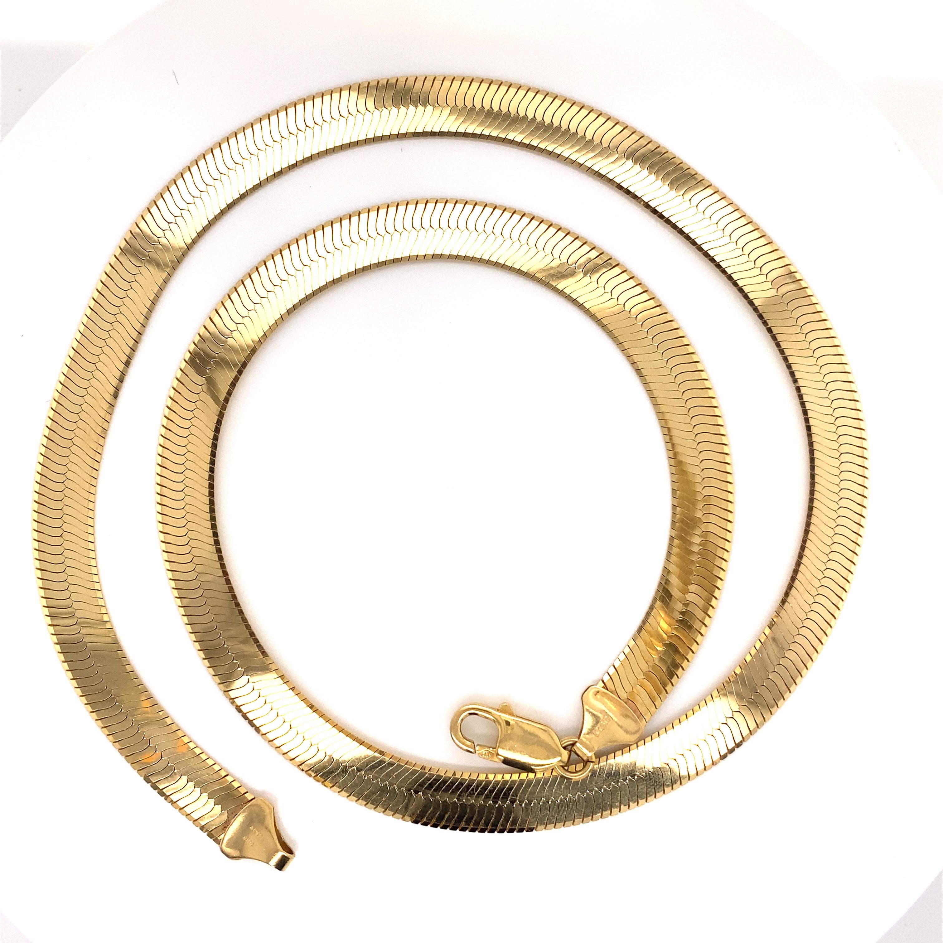 Vintage 1990’s 14K Yellow Gold Wide Herringbone Necklace - The Italian made herringbone necklace is 8mm wide and 20 inches long and features a large lobster clasp. The necklace weighs 30 grams.