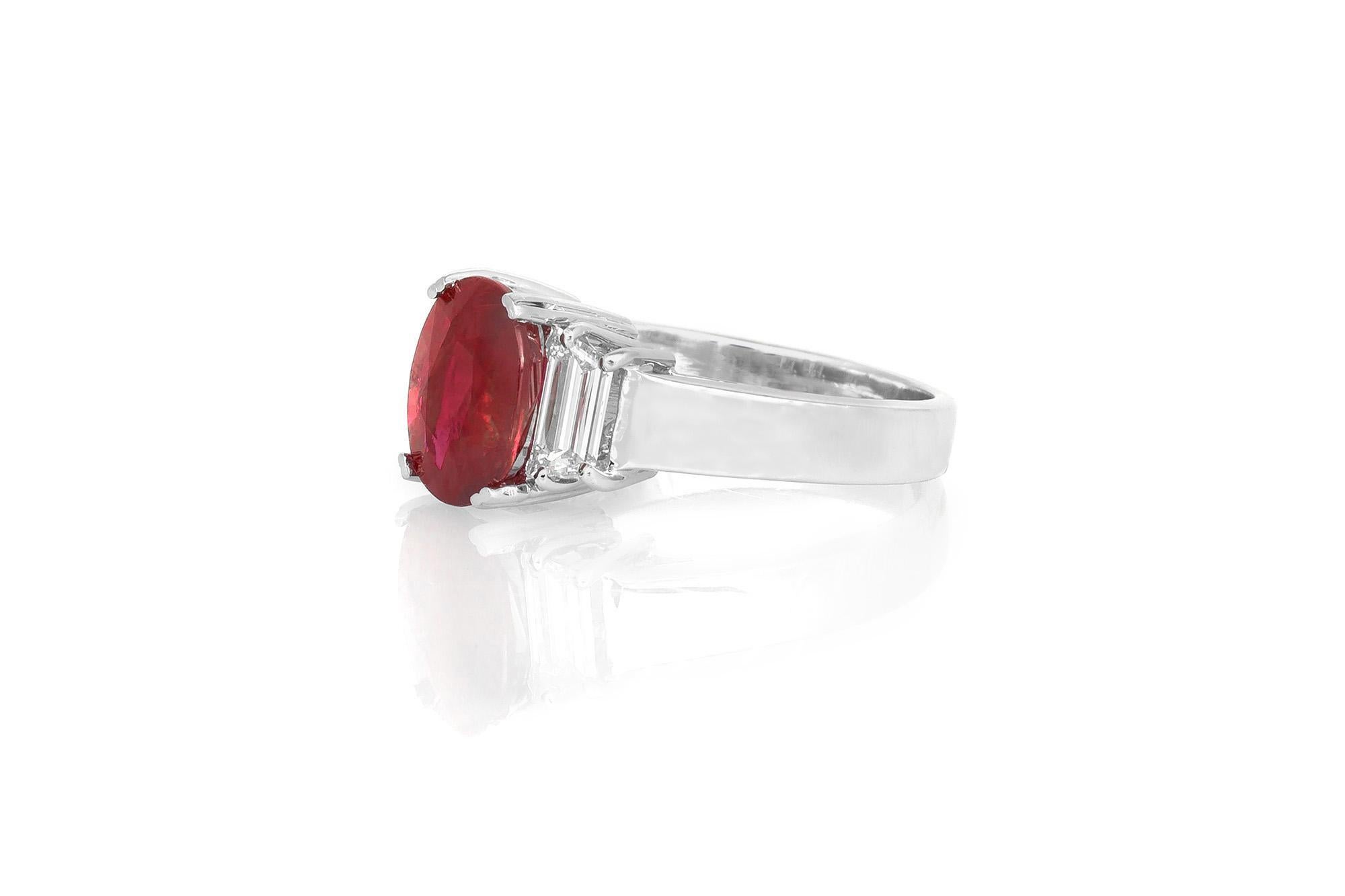 Finely crafted in platinum with an Oval Cut Ruby weighing 3.01 carats, accented by 2 Trapezoid cut Diamonds weighing a total of approximately 0.84 carat.
Circa 1990s
Size 6 1/2, resizable